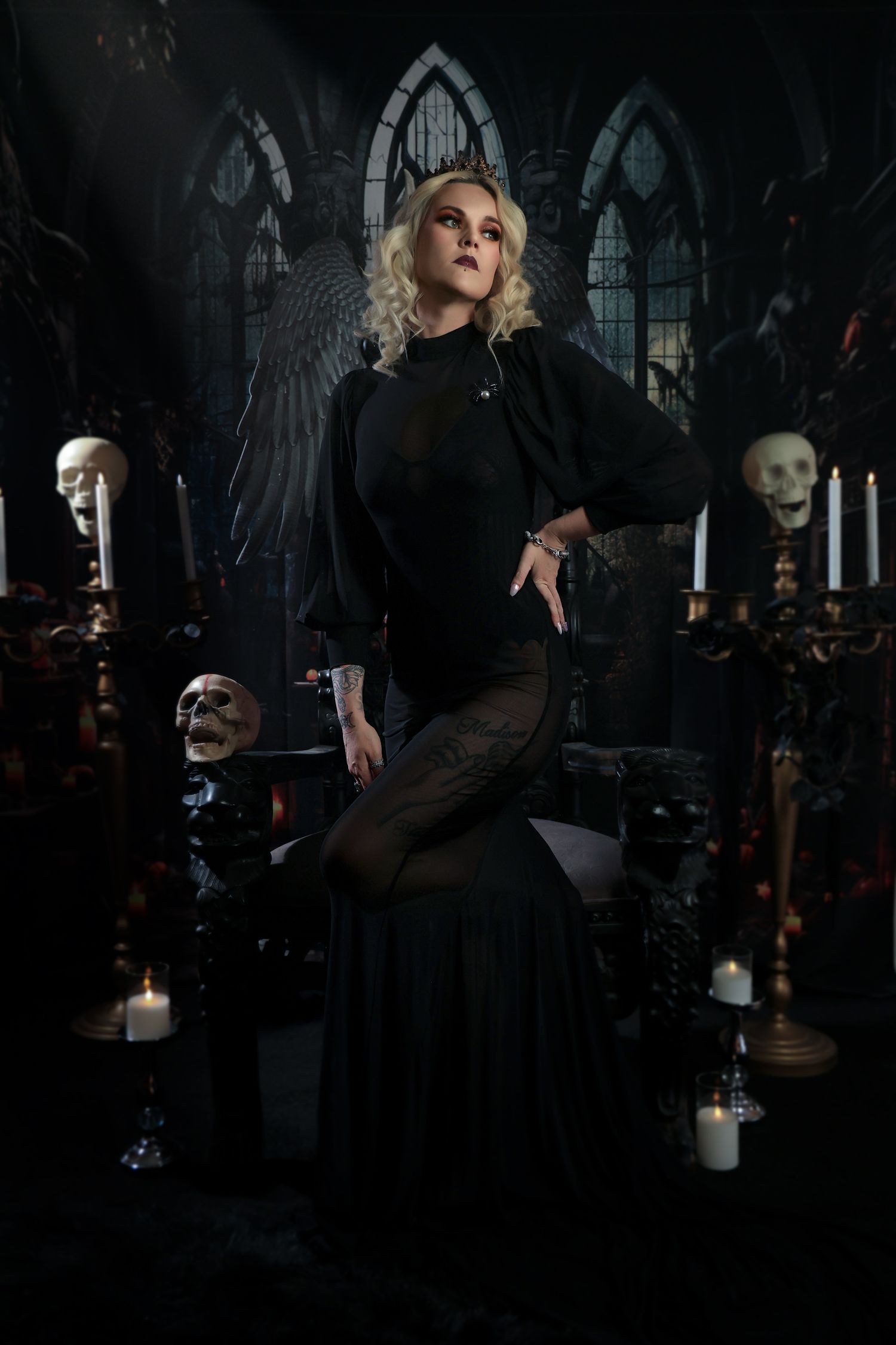 Gothic figure in black dress poses dramatically in dark church interior with dramatic lighting and shadows.