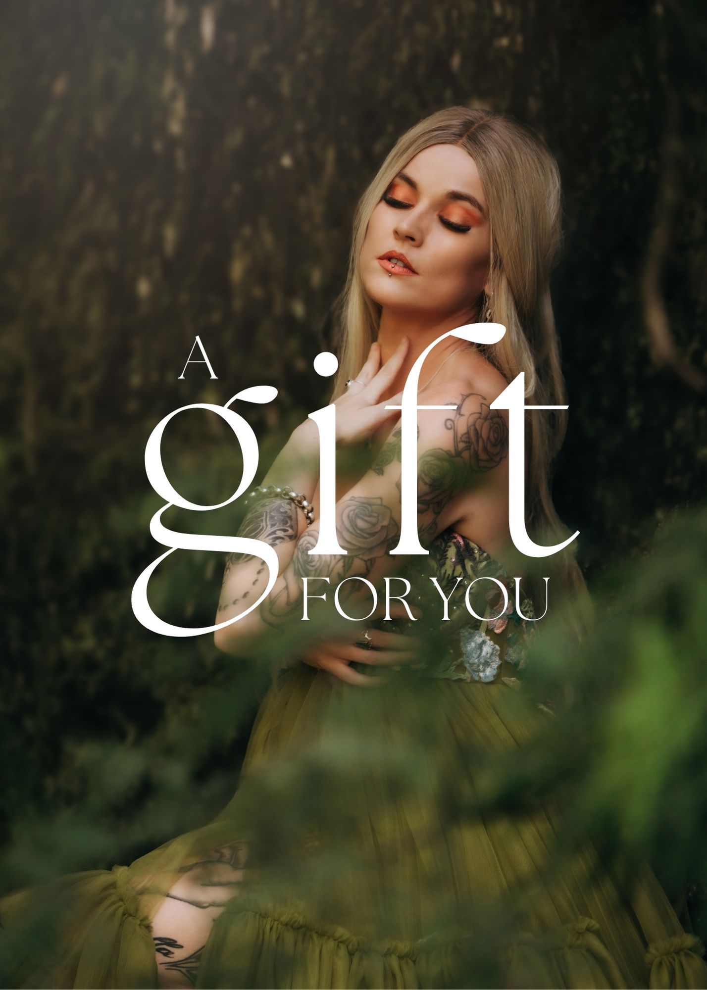 Atmospheric portrait of a woman in a green dress with eyes closed against dark nature backdrop with elegant gift text overlay.