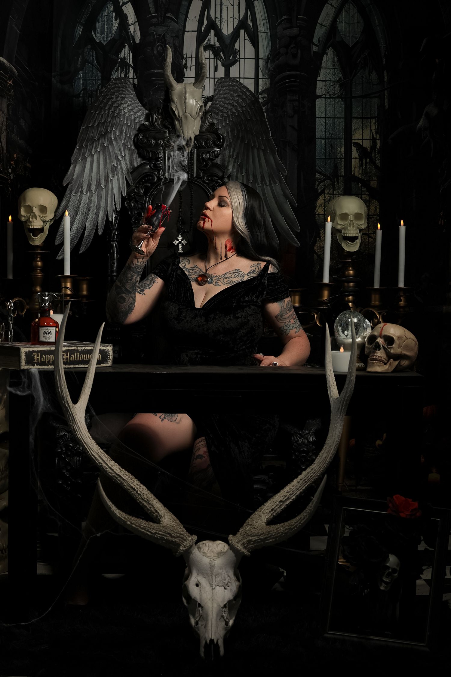 A dark gothic scene with deer skull and antlers mounted on wall in moody lighting.