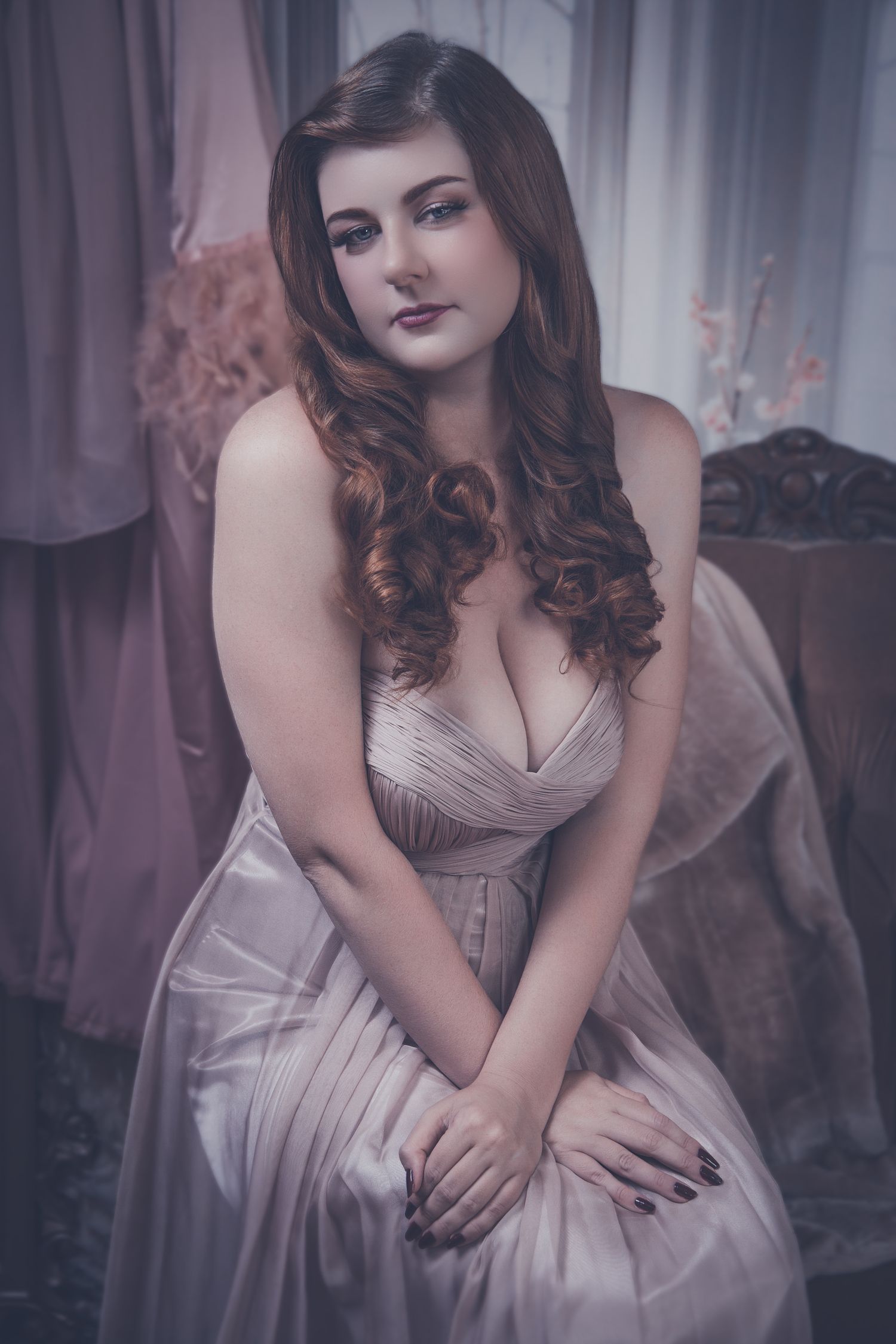 A woman in a vintage-style mauve dress poses gracefully in a dreamy, soft-focus portrait series.