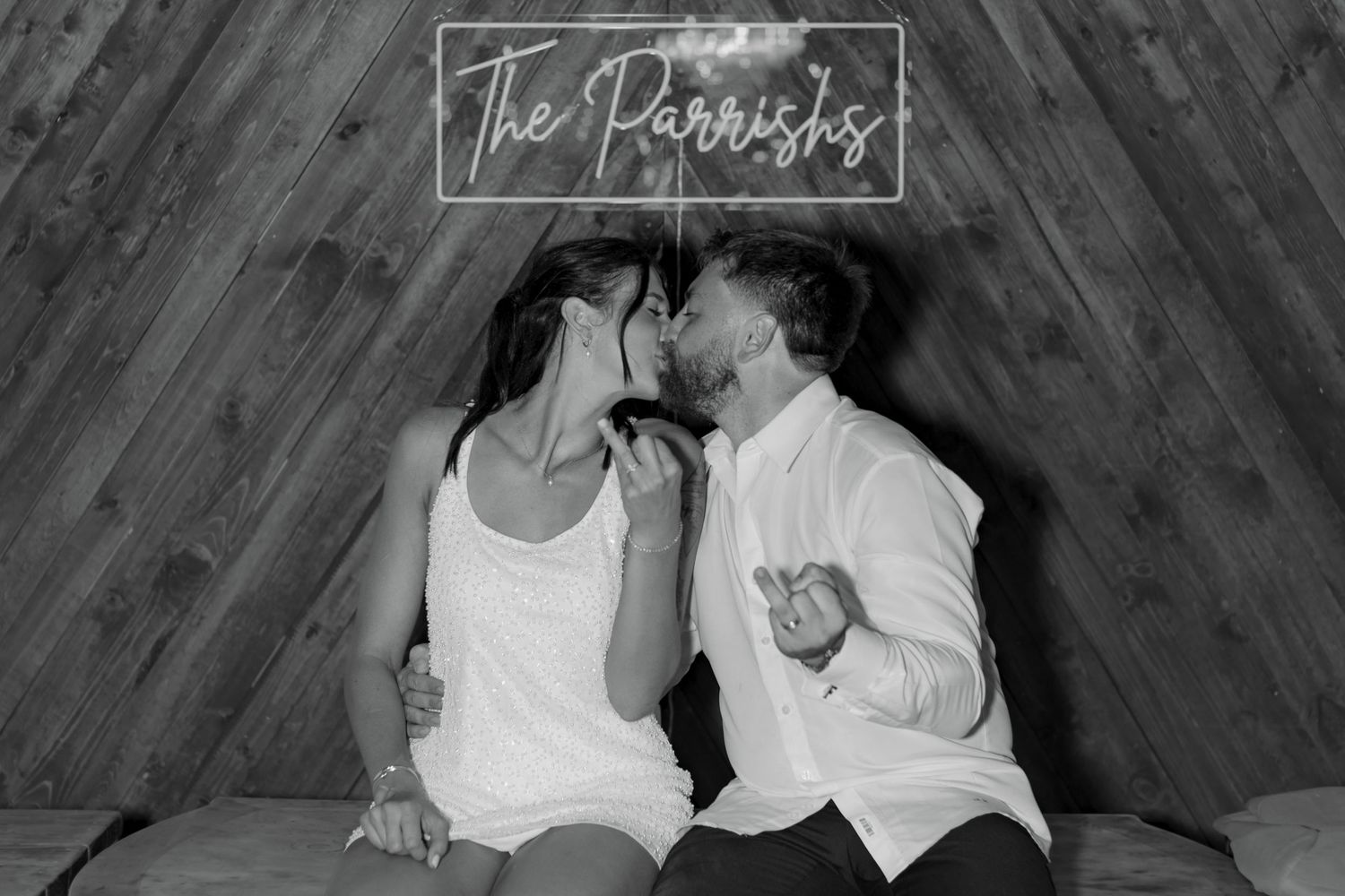 A romantic black and white photo montage showing five intimate moments between a couple on their special day.