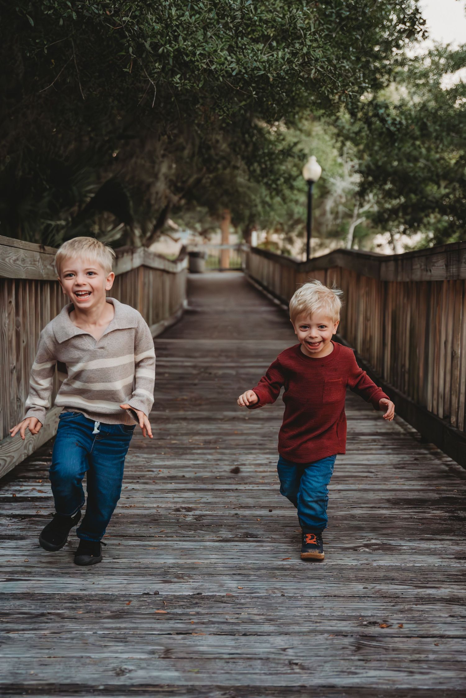 Sequence of playful movement photos showing children running and playing on a wooden boardwalk surrounded by trees in Panama City.