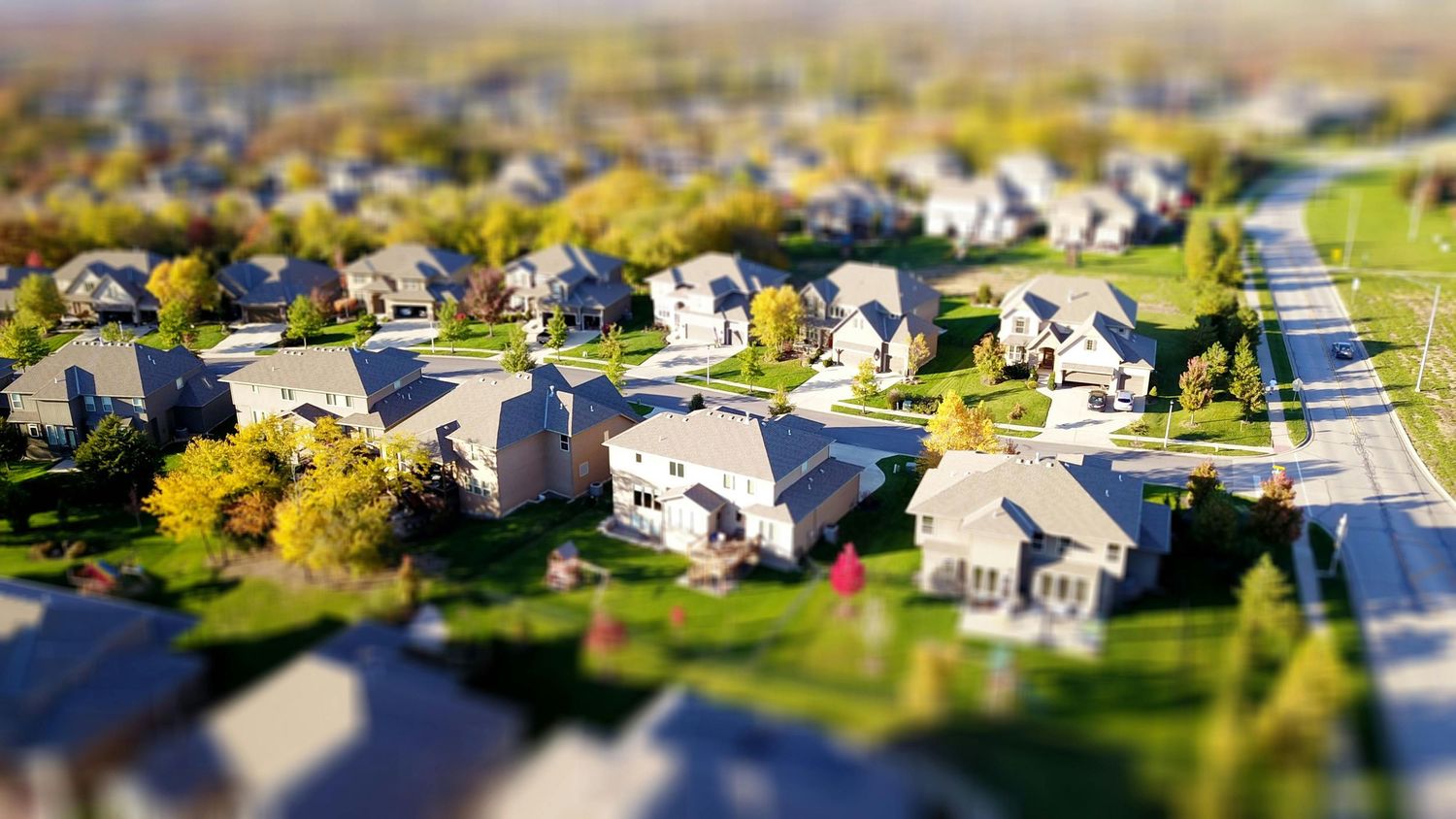 Photo of suburban houses used as background for Florida real estate photography page.