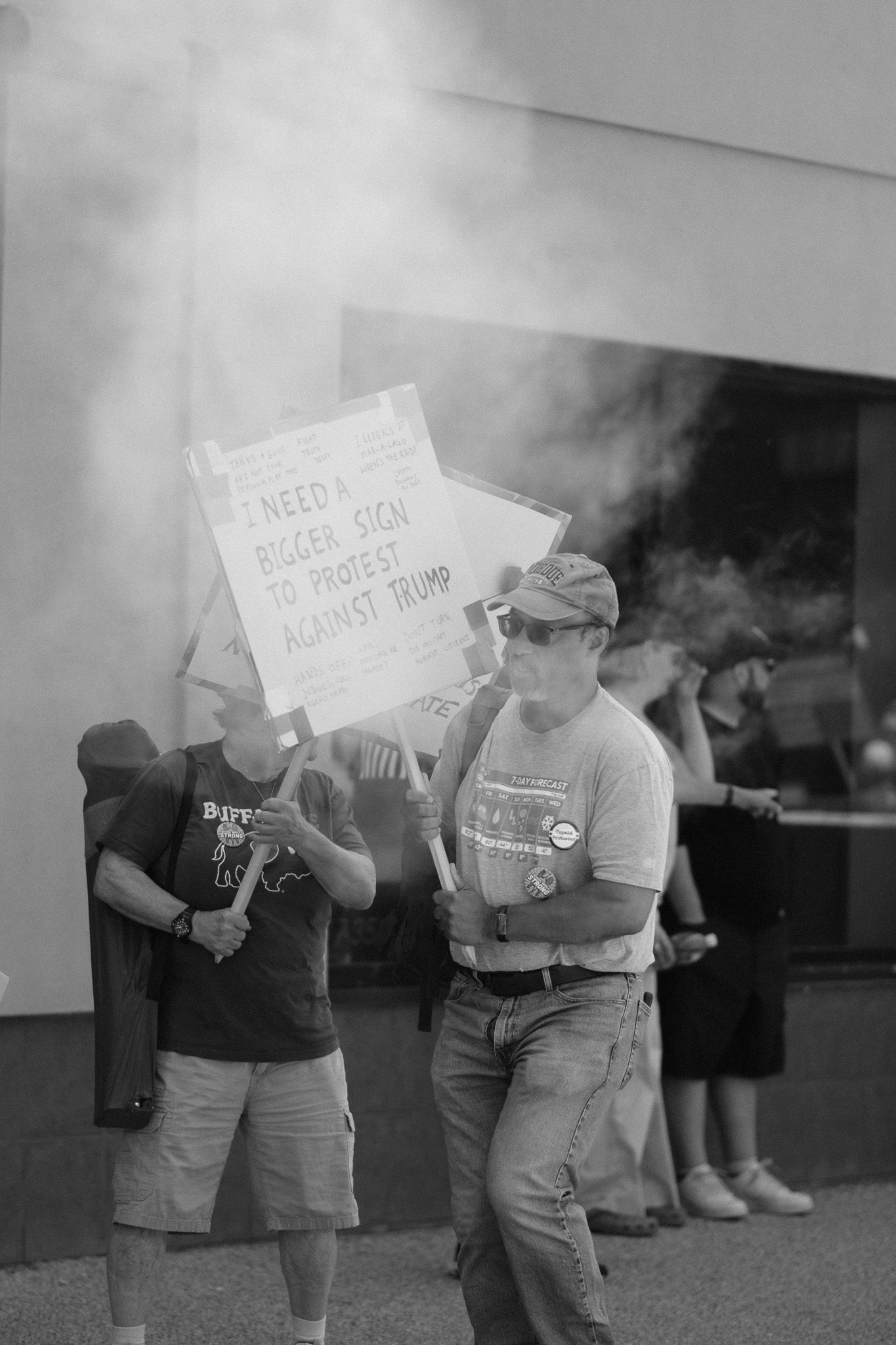 A black and white photo showing protesters holding signs from a vintage demonstration.