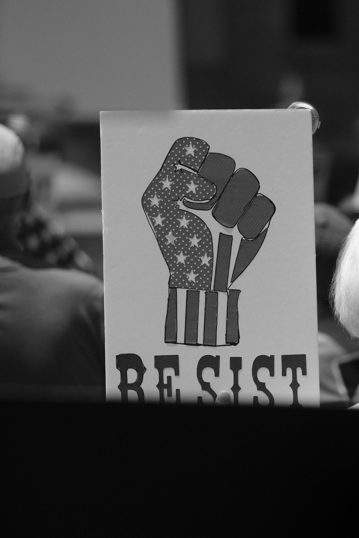 A black and white resistance sign featuring an elephant silhouette against an American flag pattern.