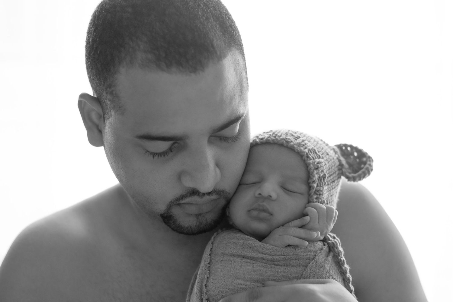 Father and new son
Parenthood 
newborn
new baby
Natural light 
fatherhood 
Photography
Black and white