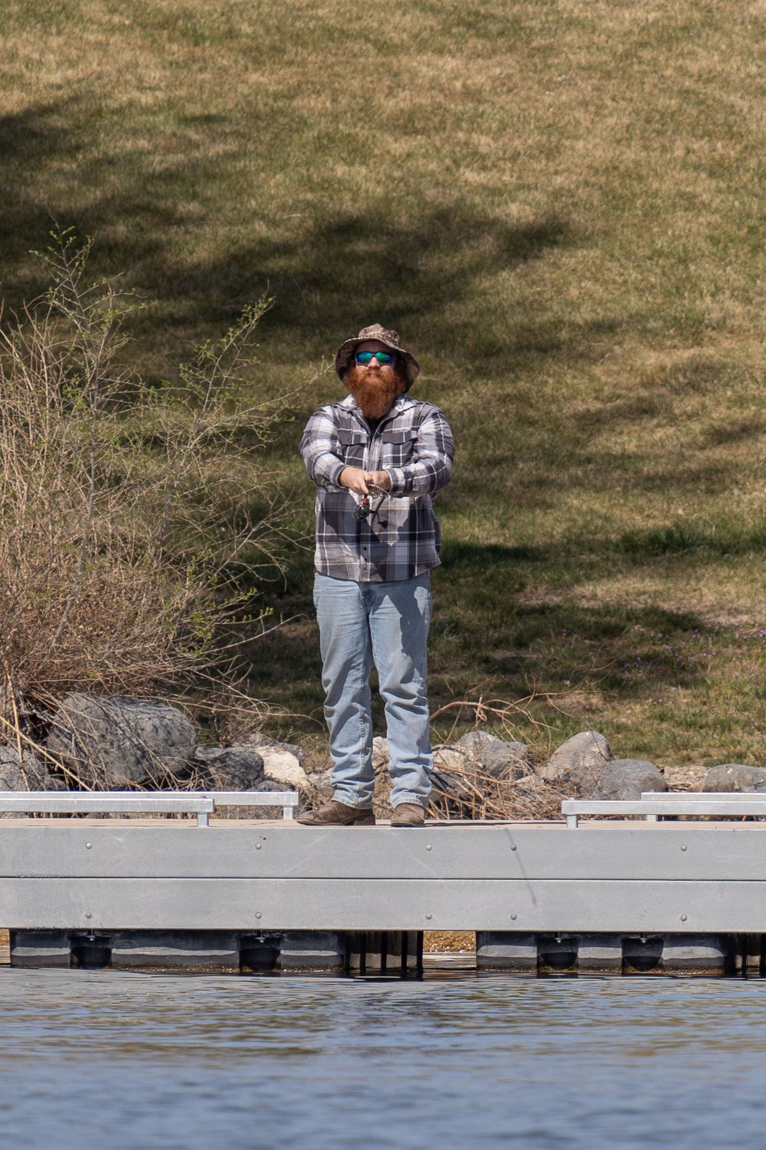 Angler fishing from a dock during the Crappie Classic at C.J. Strike Reservoir in Idaho