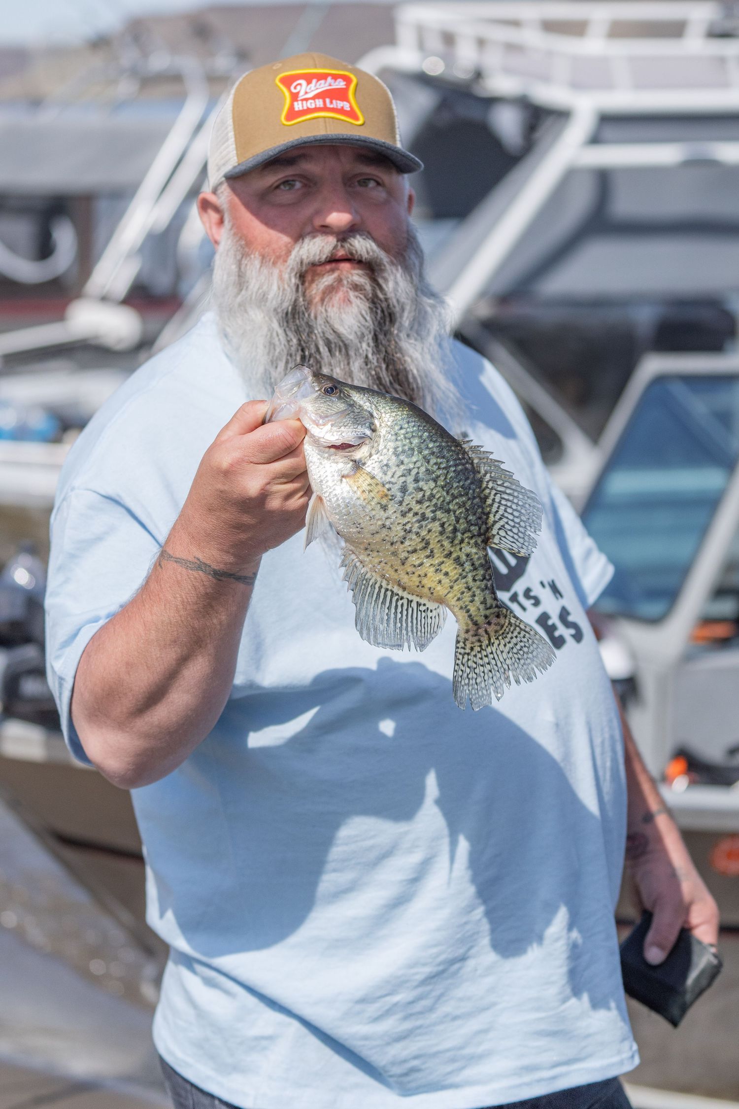 Angler holding a crappie during the Crappie Classic at Black Sands Resort on C.J. Strike Reservoir in Idaho