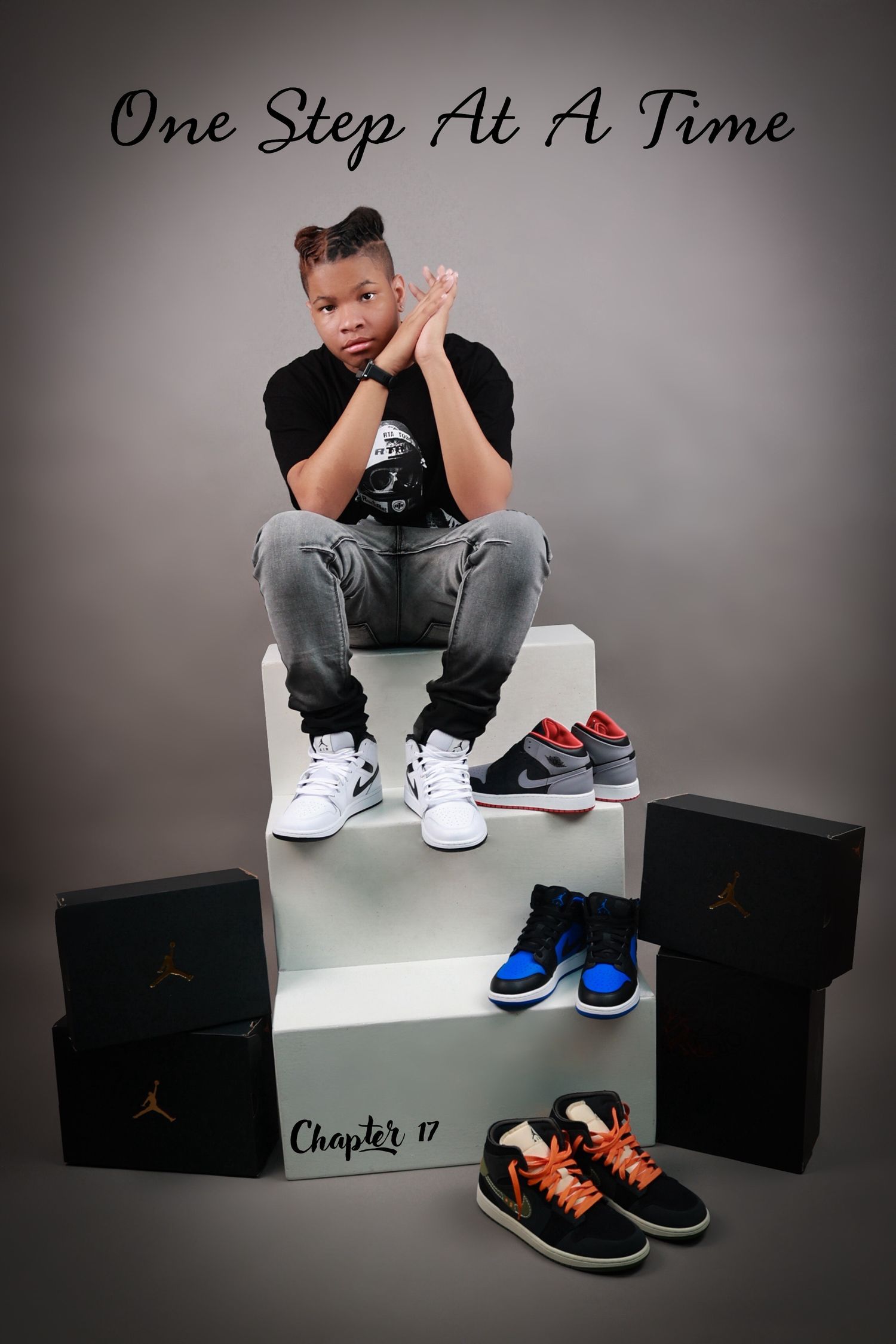 Teen boy seated on boxes with Jordan sneakers collection, Chapter 17 birthday photo shoot.