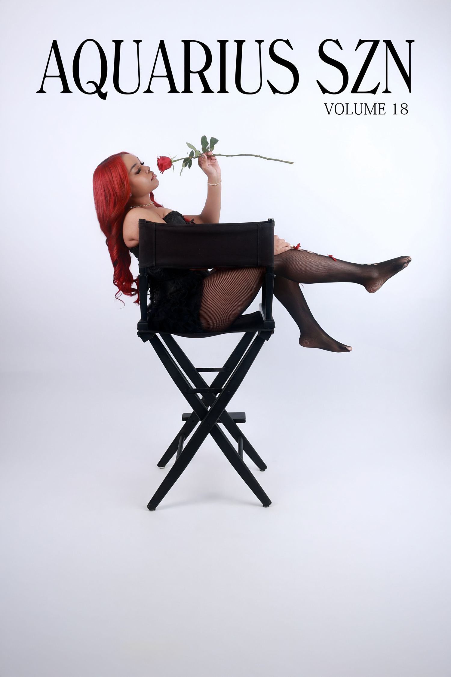 Woman with red hair holding rose seated in directors chair for Aquarius SZN Volume 18.