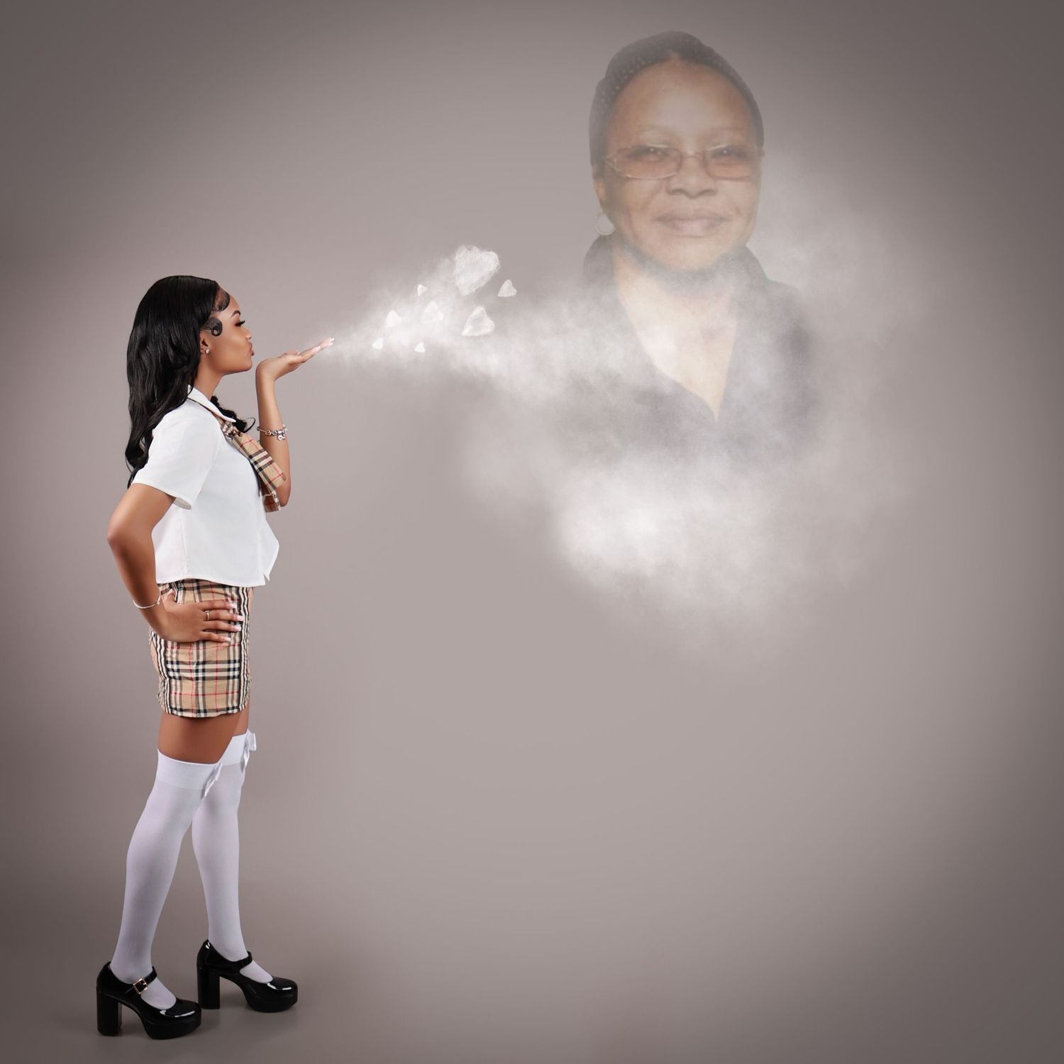 Woman in school uniform blowing kiss creating smoke portrait of elderly person in background.