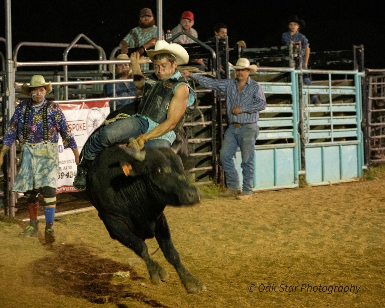 man riding a bull in a rodeo
