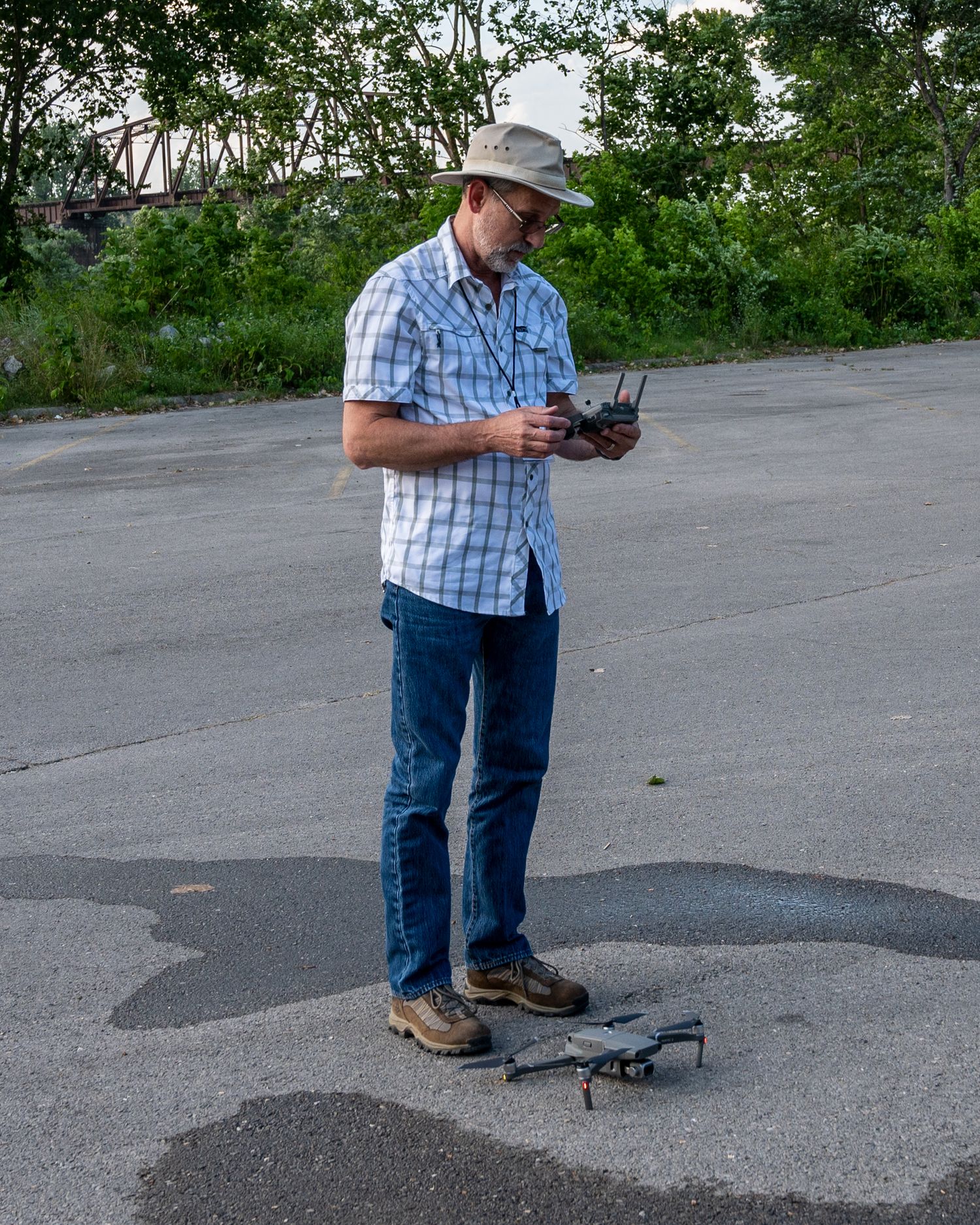 man launching quad-copter drone