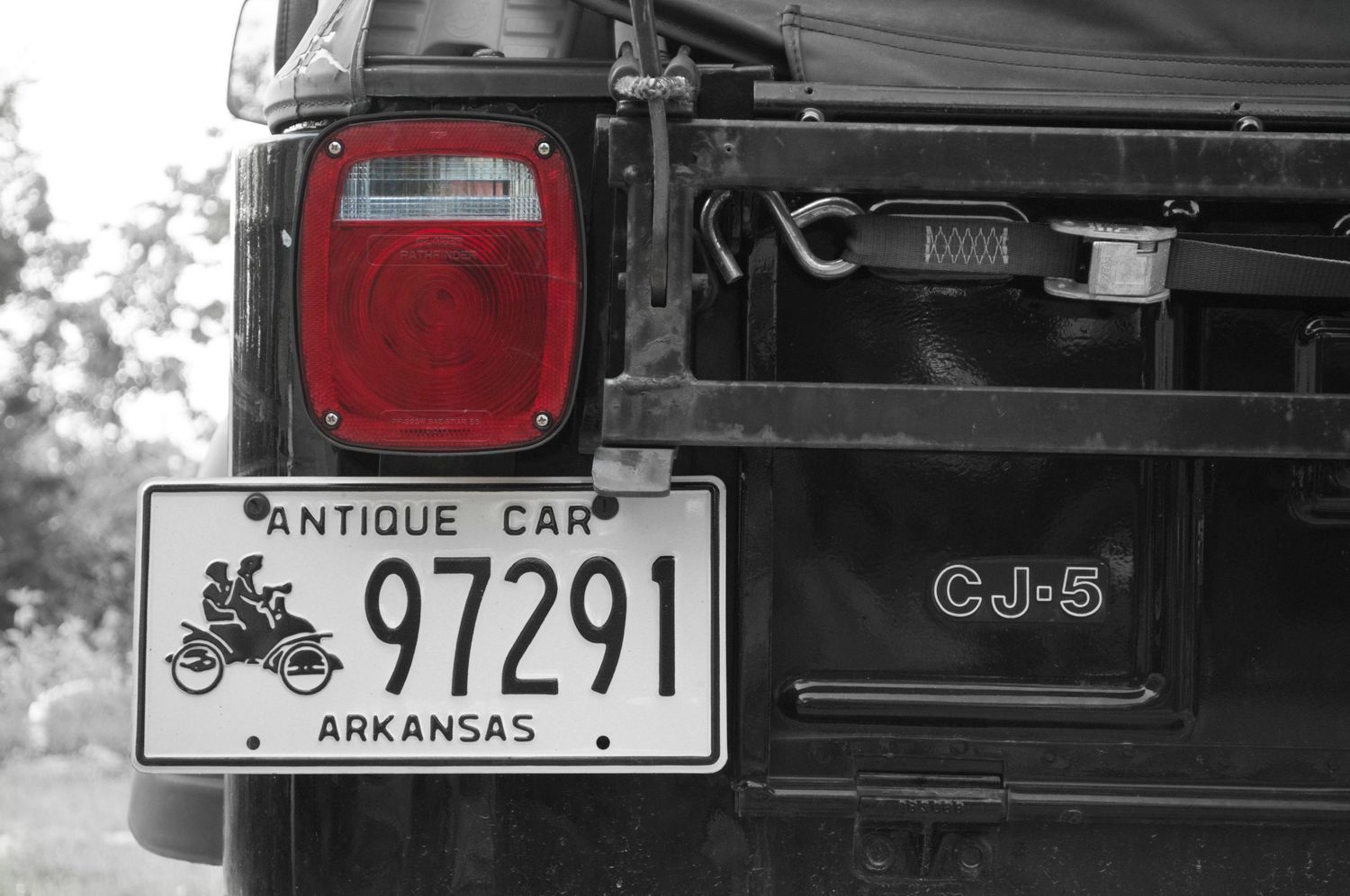 Back of a Jeep CJ-5 with antique tags