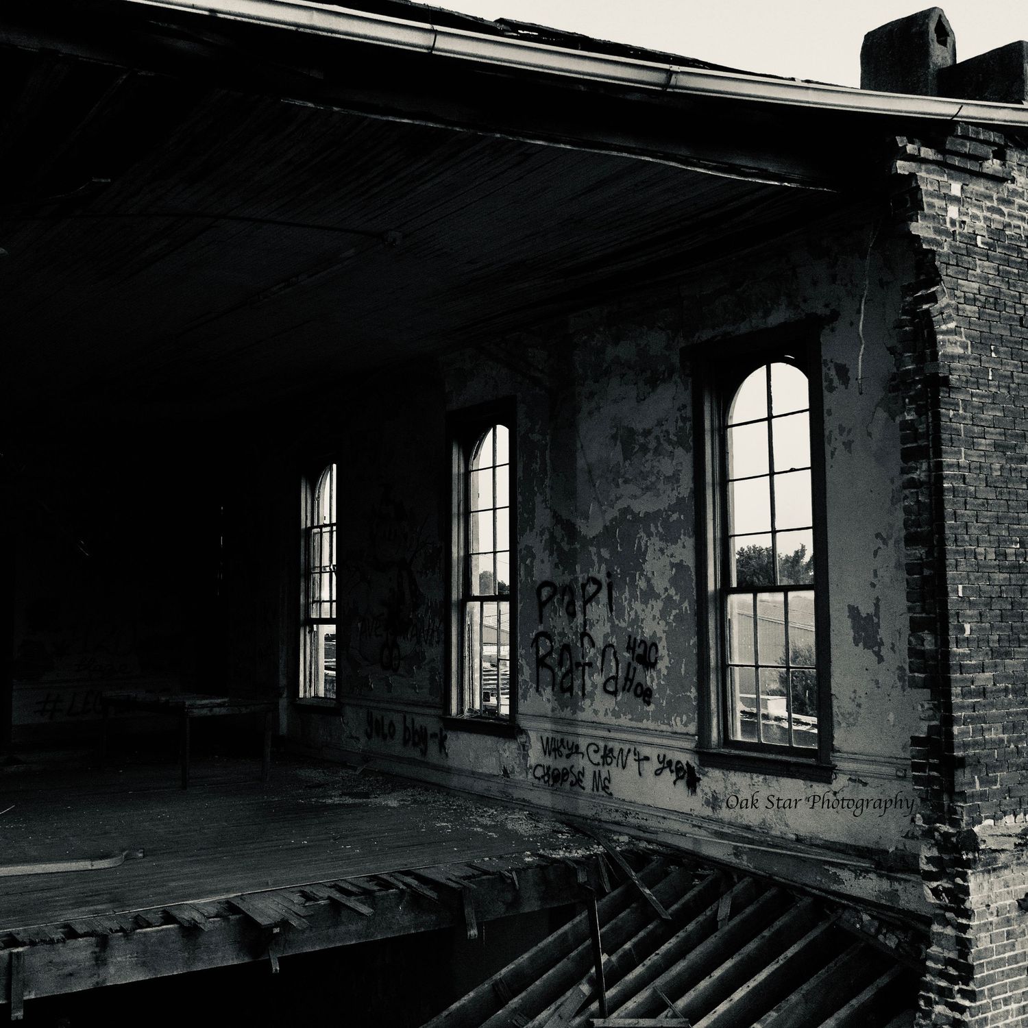 three windows as seen from the inside through a missing back wall