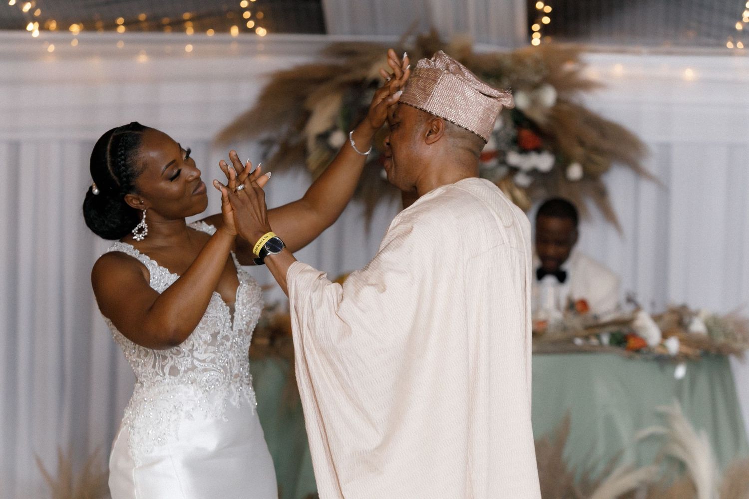 Joyful moment shared between wedding couple during reception celebrations.