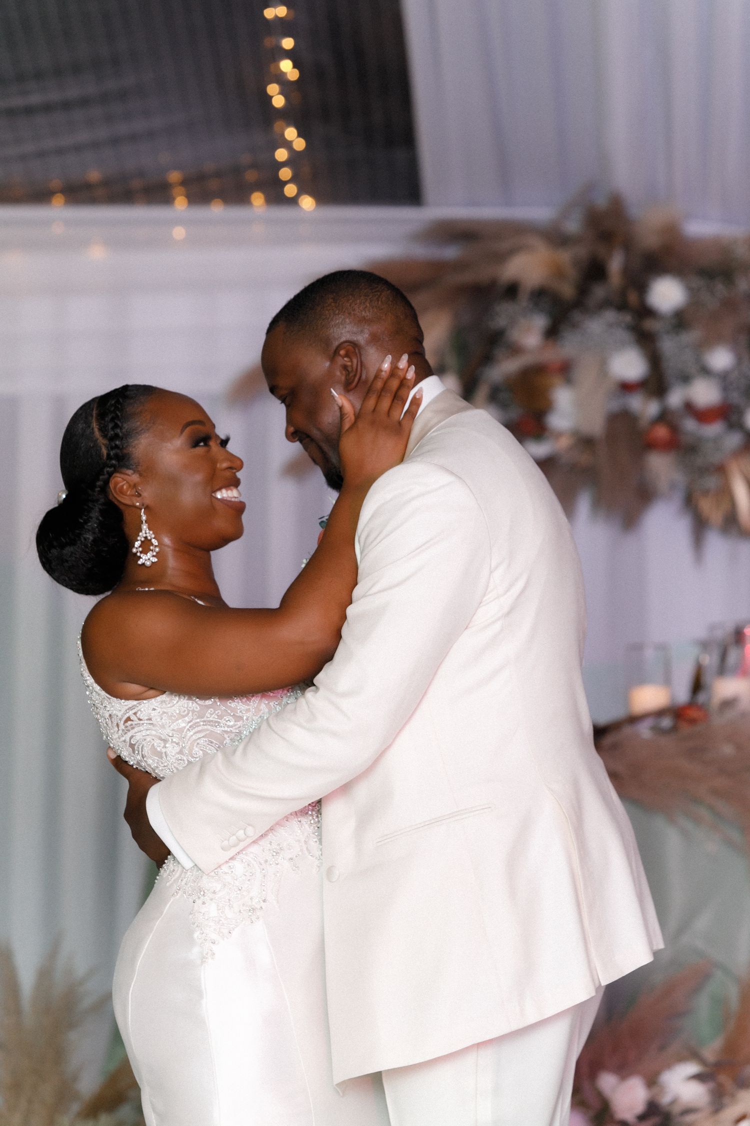 Intimate moment between newlyweds during their wedding reception.