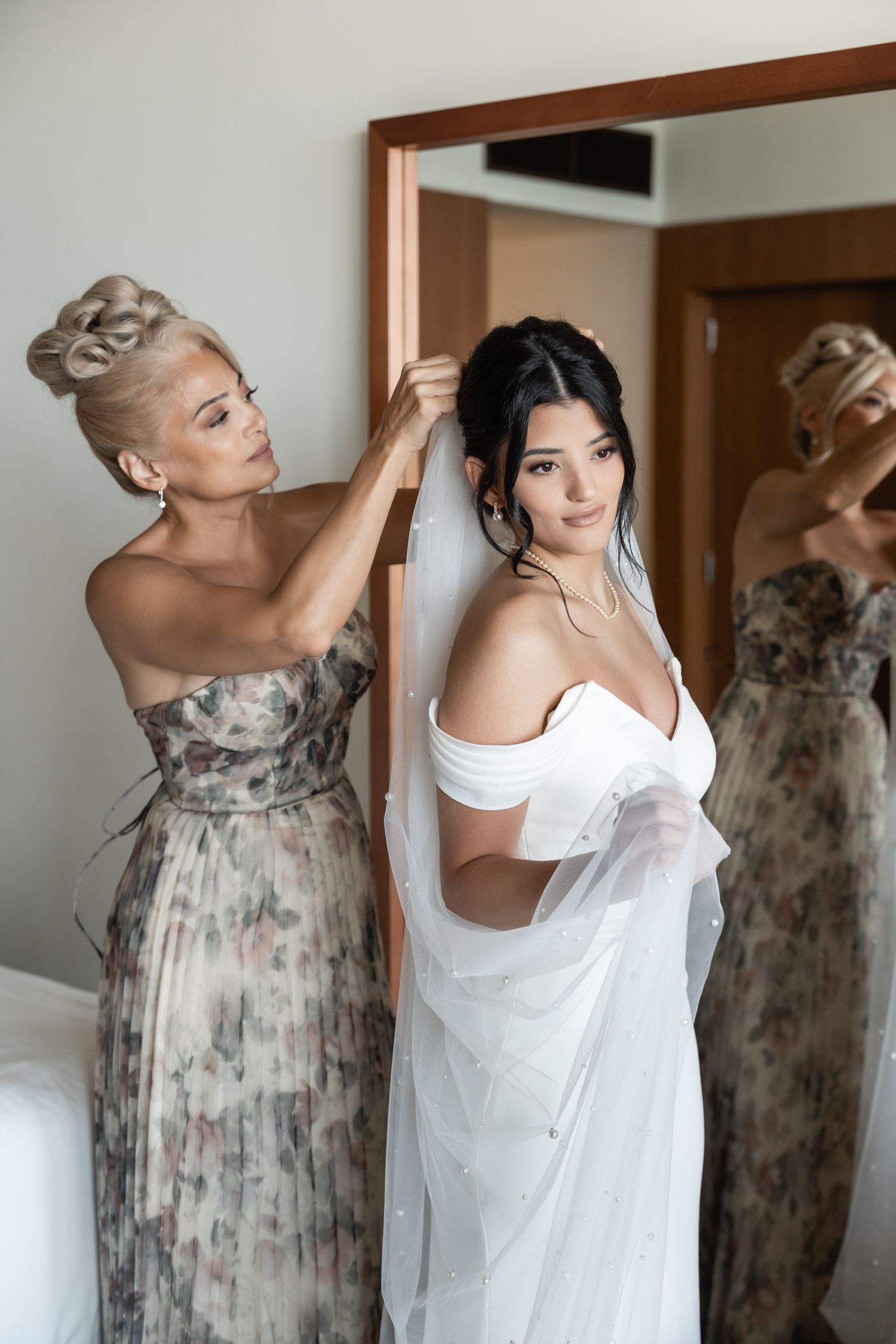 Getting ready moment as final touches are made to the bridal look before the ceremony.