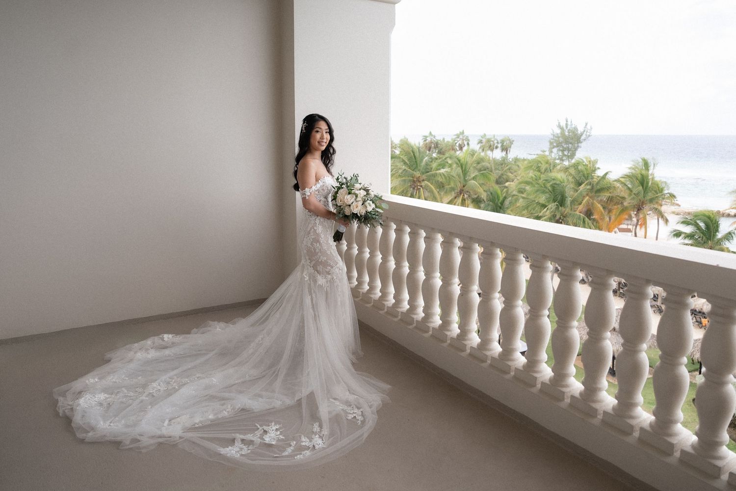 A bridal portrait at the balcony of the Hyatt Montego Bay Hotel photographed by myphotomagic by Olga