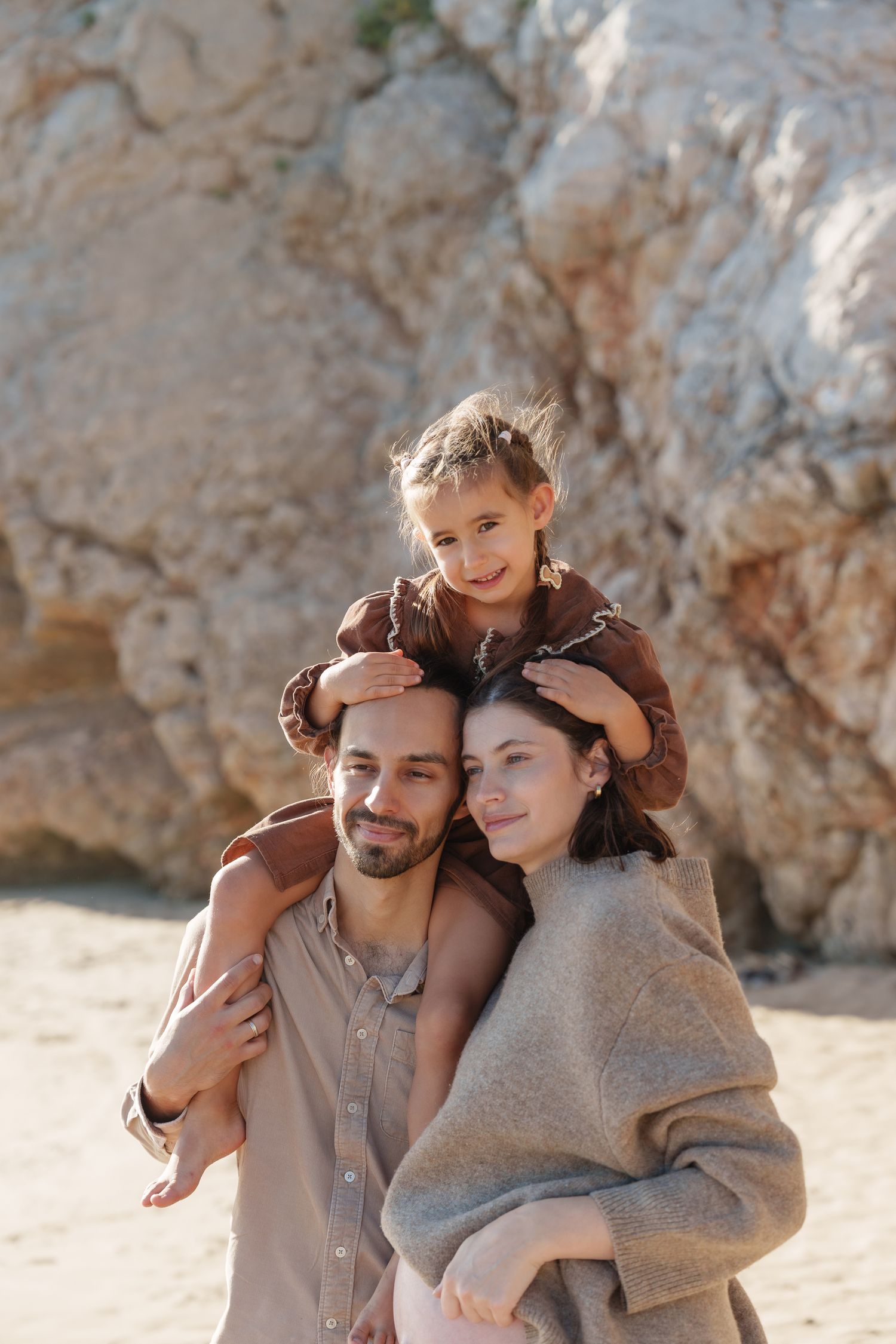 A family with a daughter photoshoot at the beach by the Bracelona and Montego Bay photographer Olga Sam
