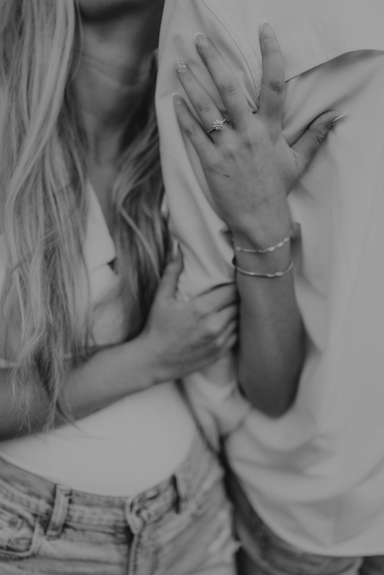 Black and white intimate photo showing hands and jewelry details.

Georgia-based wedding and elopement photographer traveling throughout the