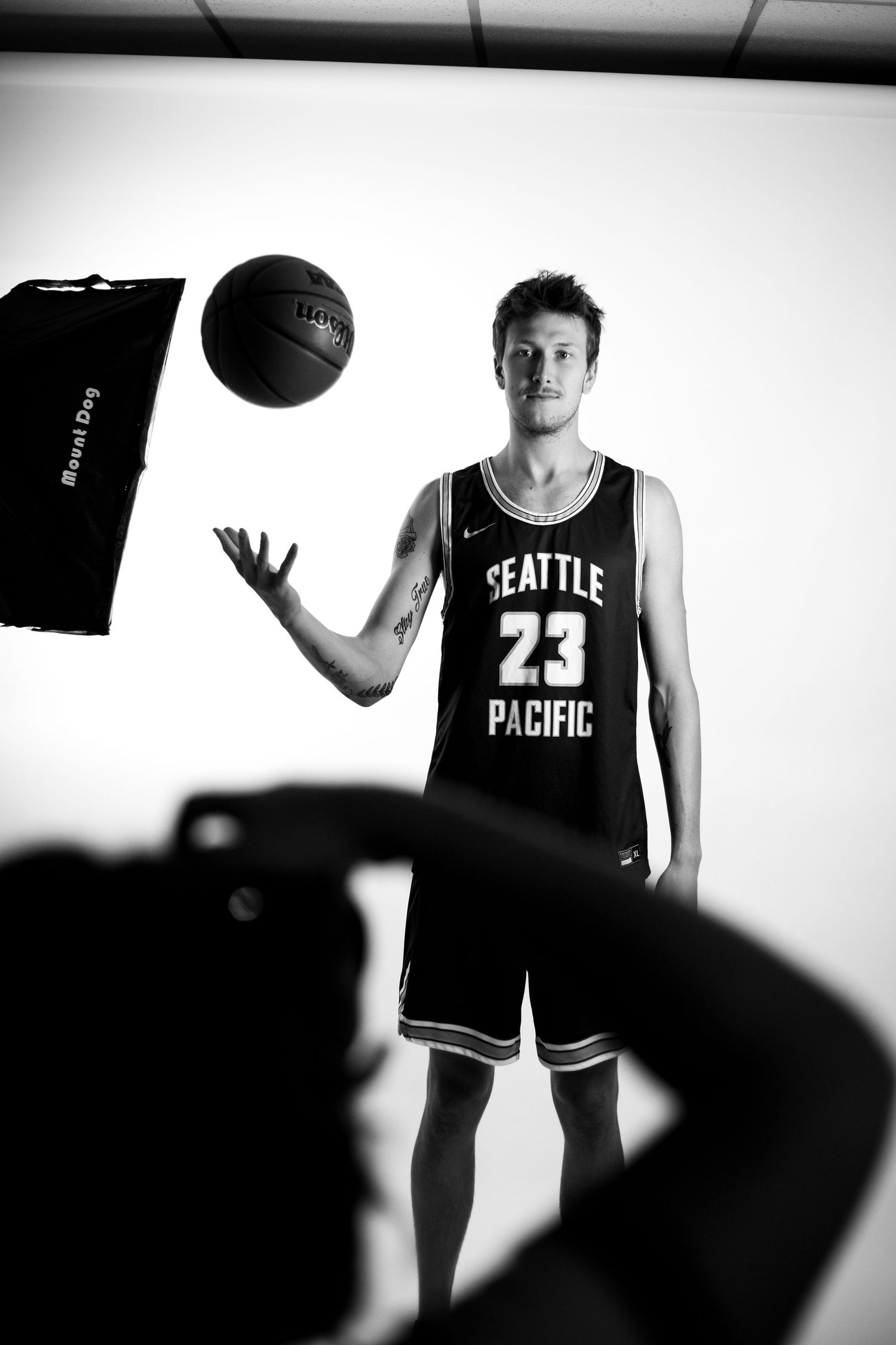 Media day behind-the-scenes - A studio photoshoot setup showing camera equipment and Seattle Pacific basketball jersey.