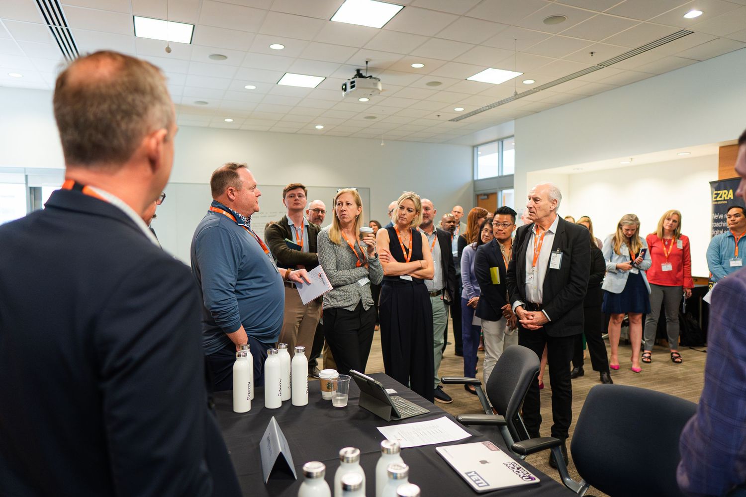 Business conference room with attendees gathered for presentation or meeting.