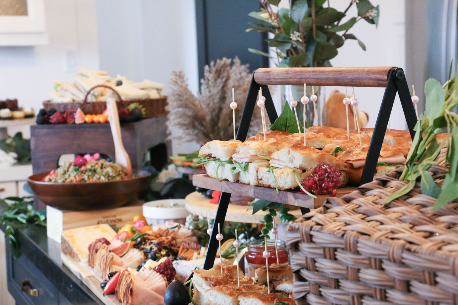 Elegant party buffet table with various appetizers and snacks beautifully displayed.