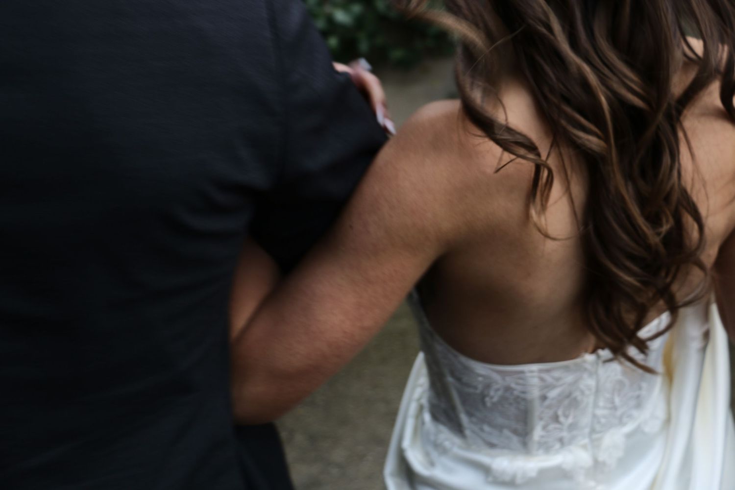 Intimate close-up of couple in wedding attire sharing a tender moment.