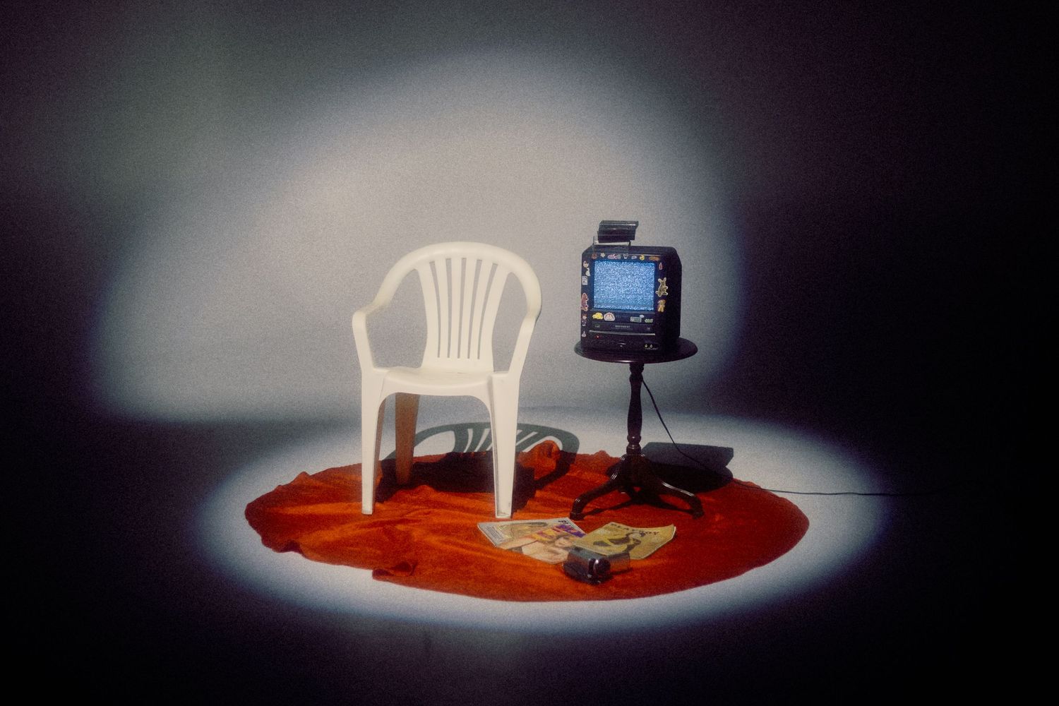 a chair and a tv in a dark room