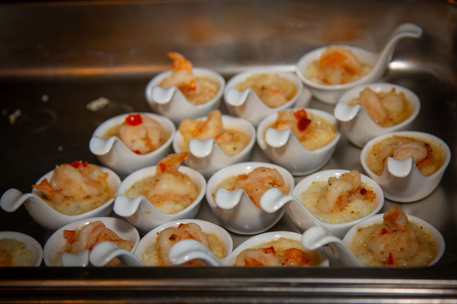Fresh shrimp hors d’oeuvres displayed on a platter during a festive party.