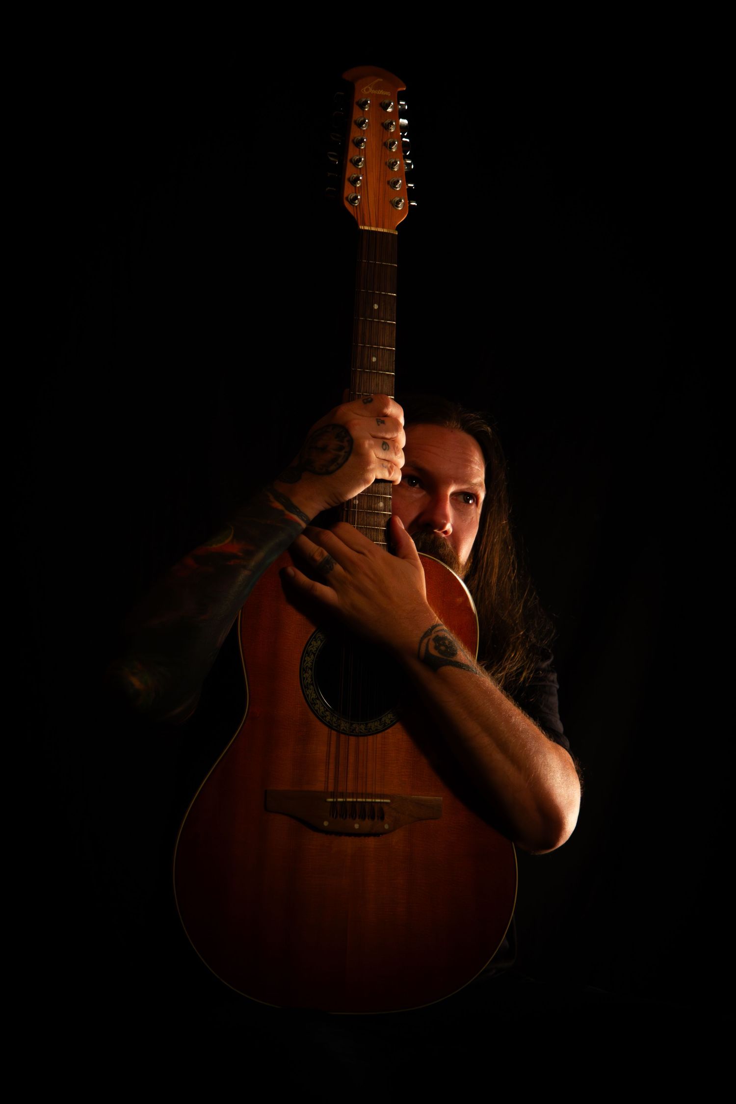 Artistic portrait of a musician taken for a promotional event flyer or poster.