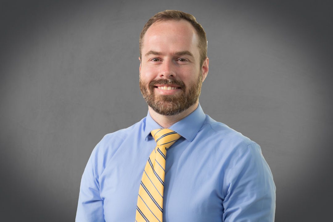 Clean and professional corporate headshot of a man in Charlotte, Durham, Raleigh, and Chapel Hill, suitable for business profiles and execut