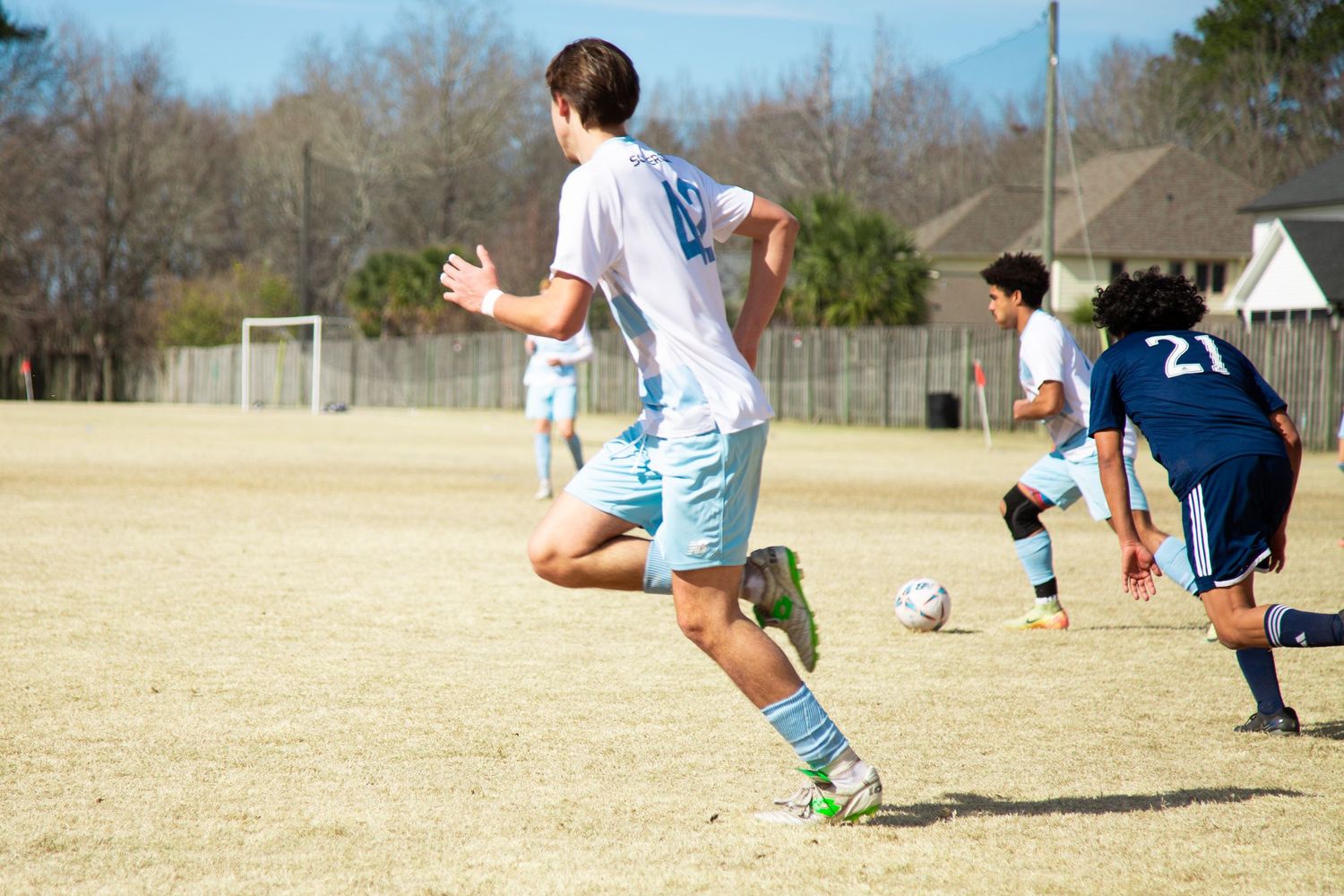 Soccer player in motion during a game — dynamic sports photography capturing speed and focus.
