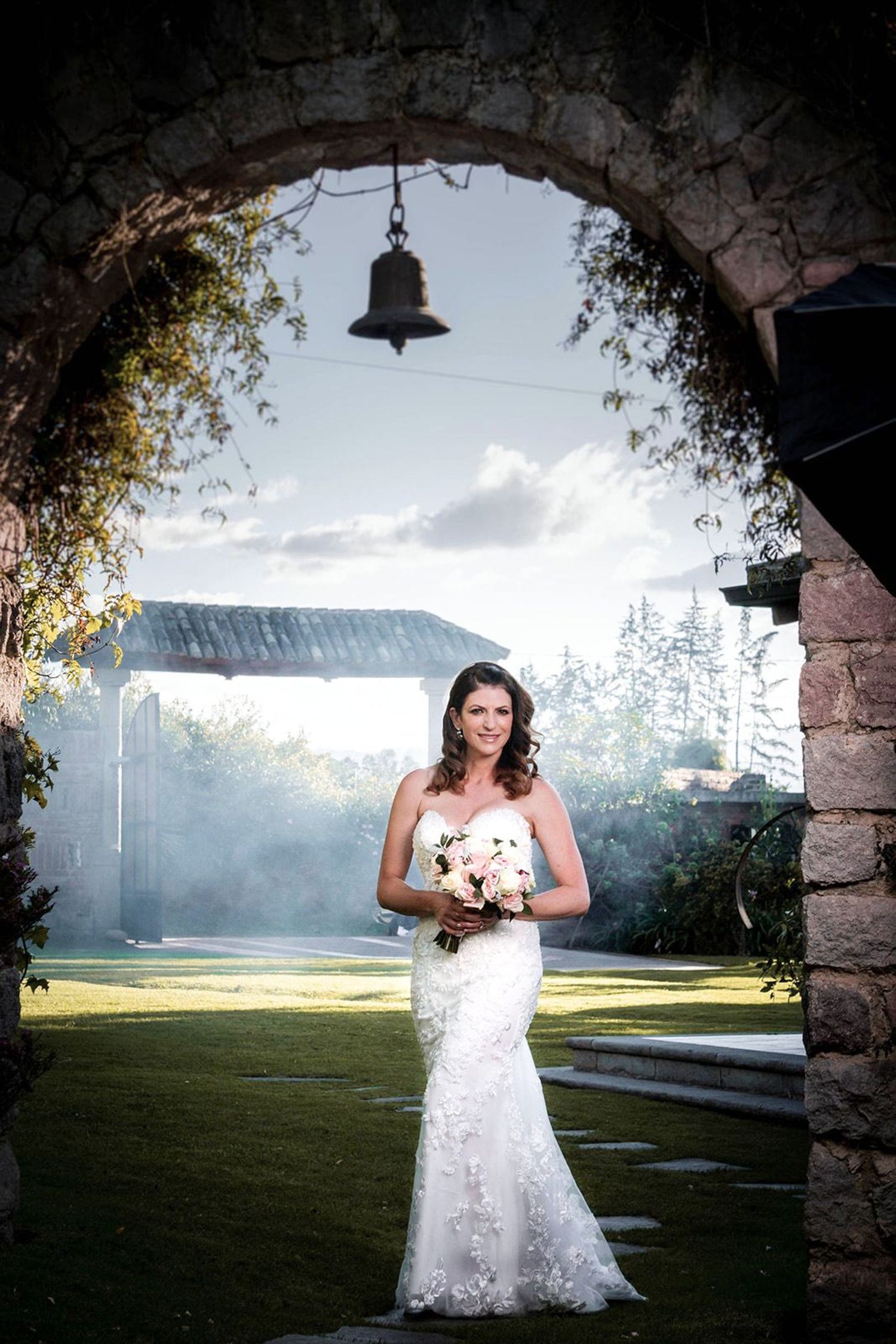 Elegant bride posing solo without her bouquet in downtown Raleigh.