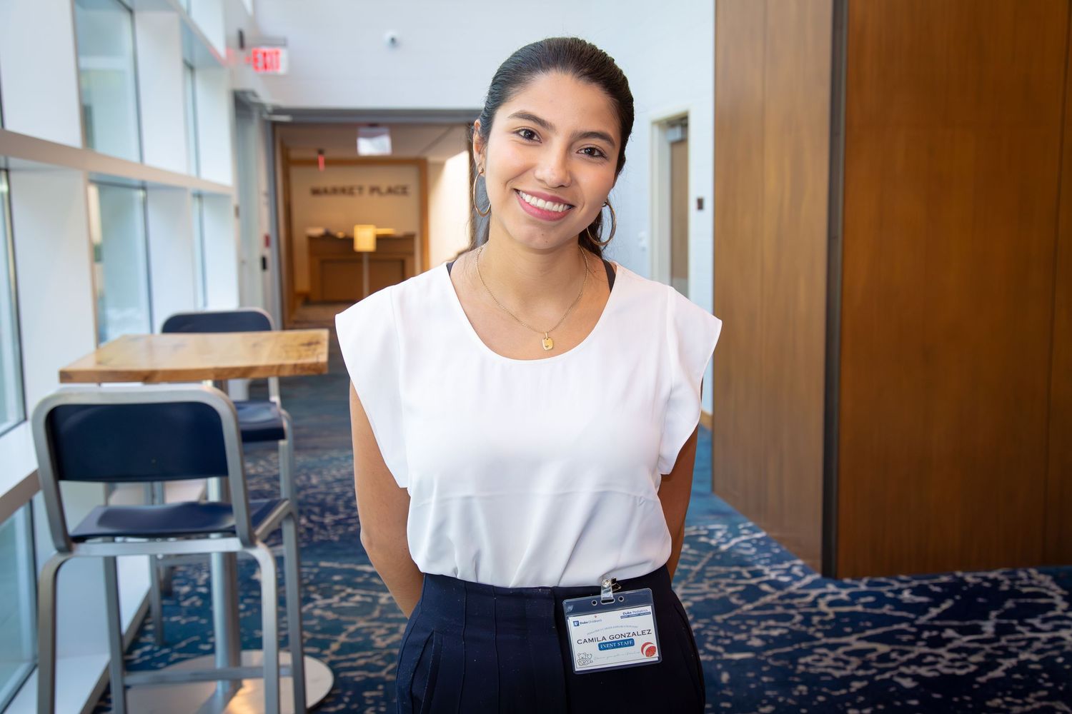 University student engaging with the audience during a professional conference in Durham.