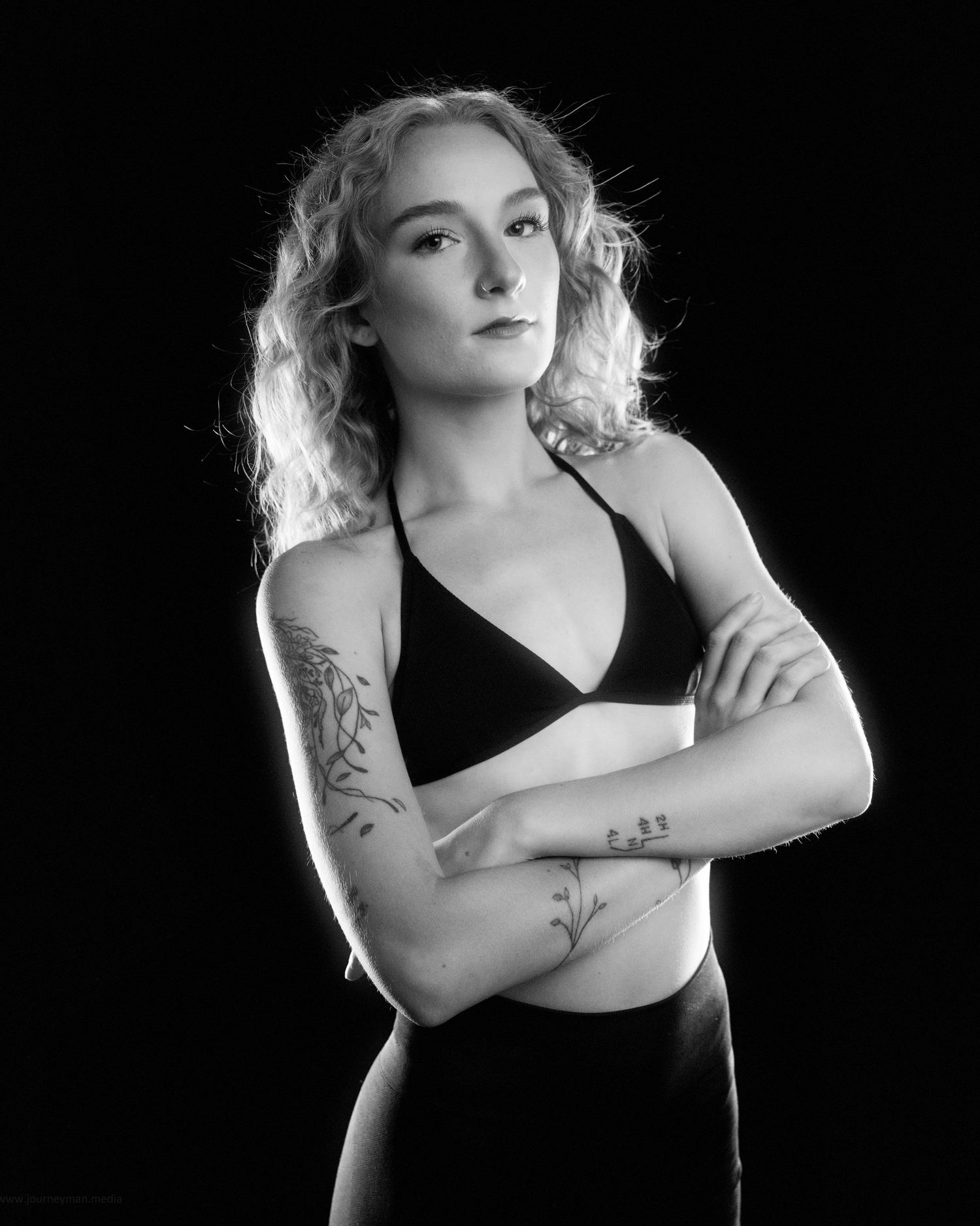 A dramatic black and white portrait series showing artistic poses against a dark background.