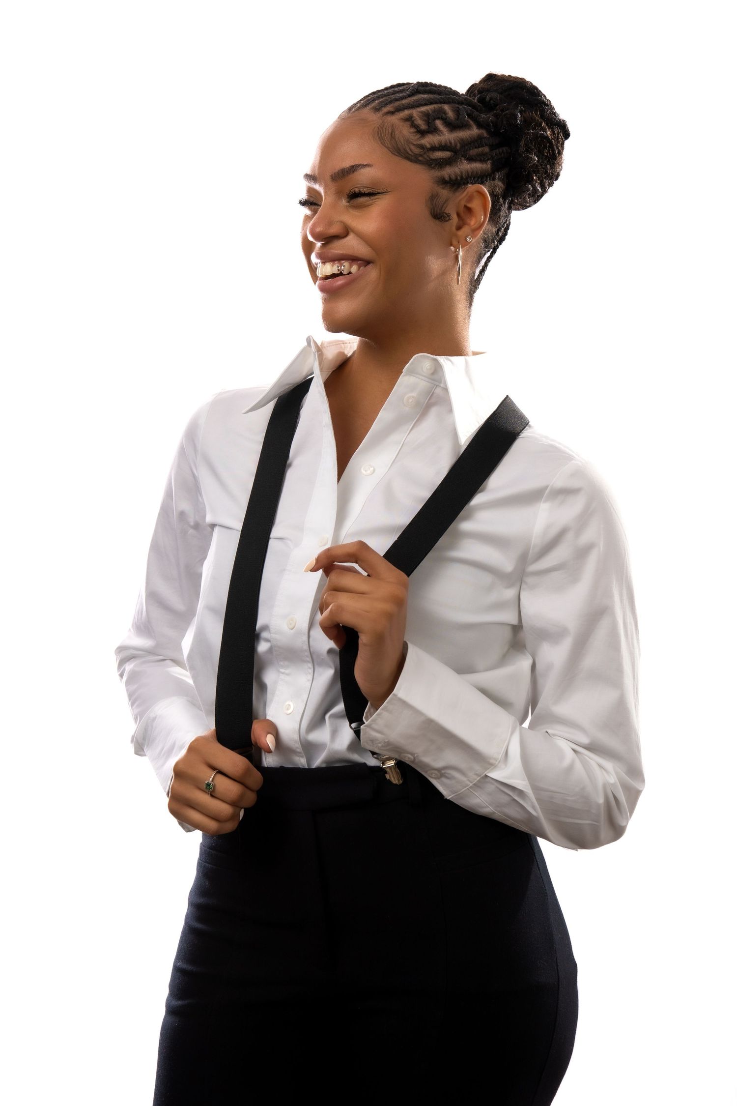 Professional wearing a crisp white button-down shirt and black suspenders laughs joyfully in multiple poses.