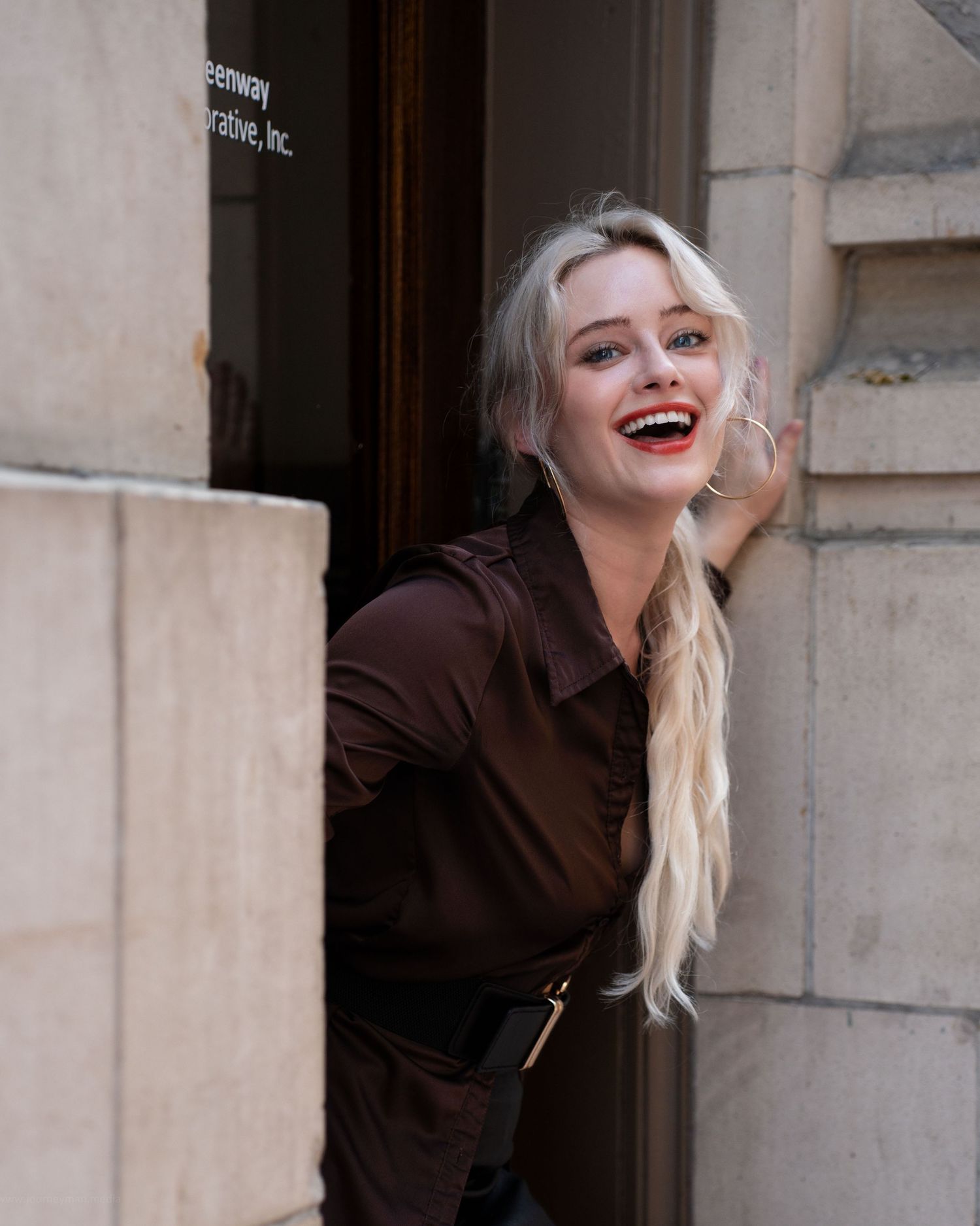 Fashion portrait series showing expressive poses against stone architecture background.
