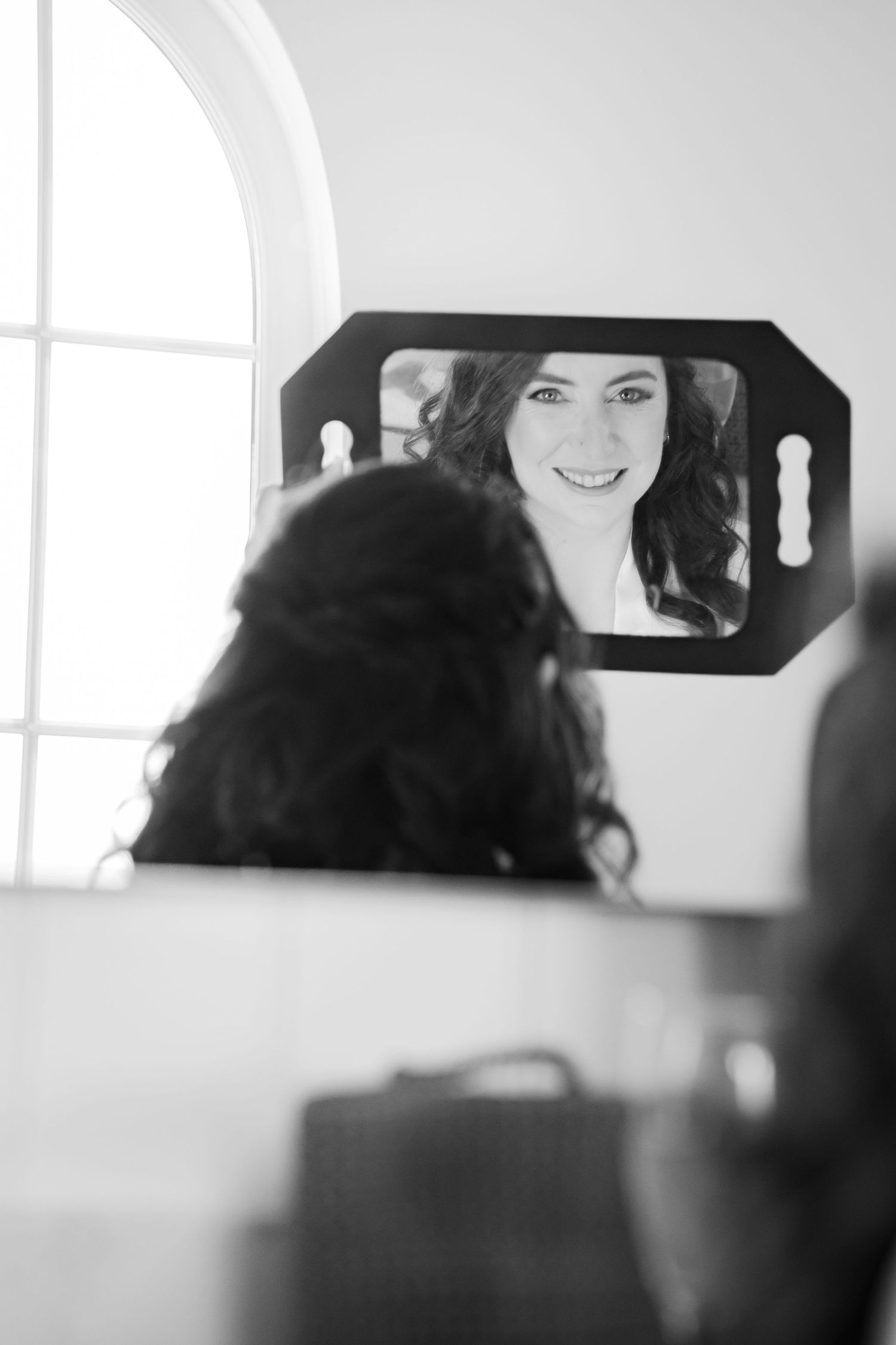 Black and white photograph sequence showing three close-up portraits with soft lighting and graduation caps.