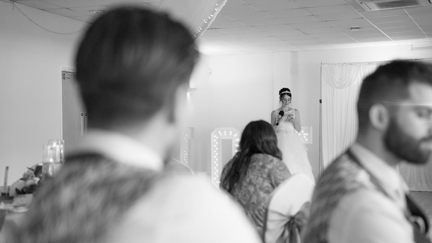 Series of blurred black and white images showing preparations in an indoor setting.