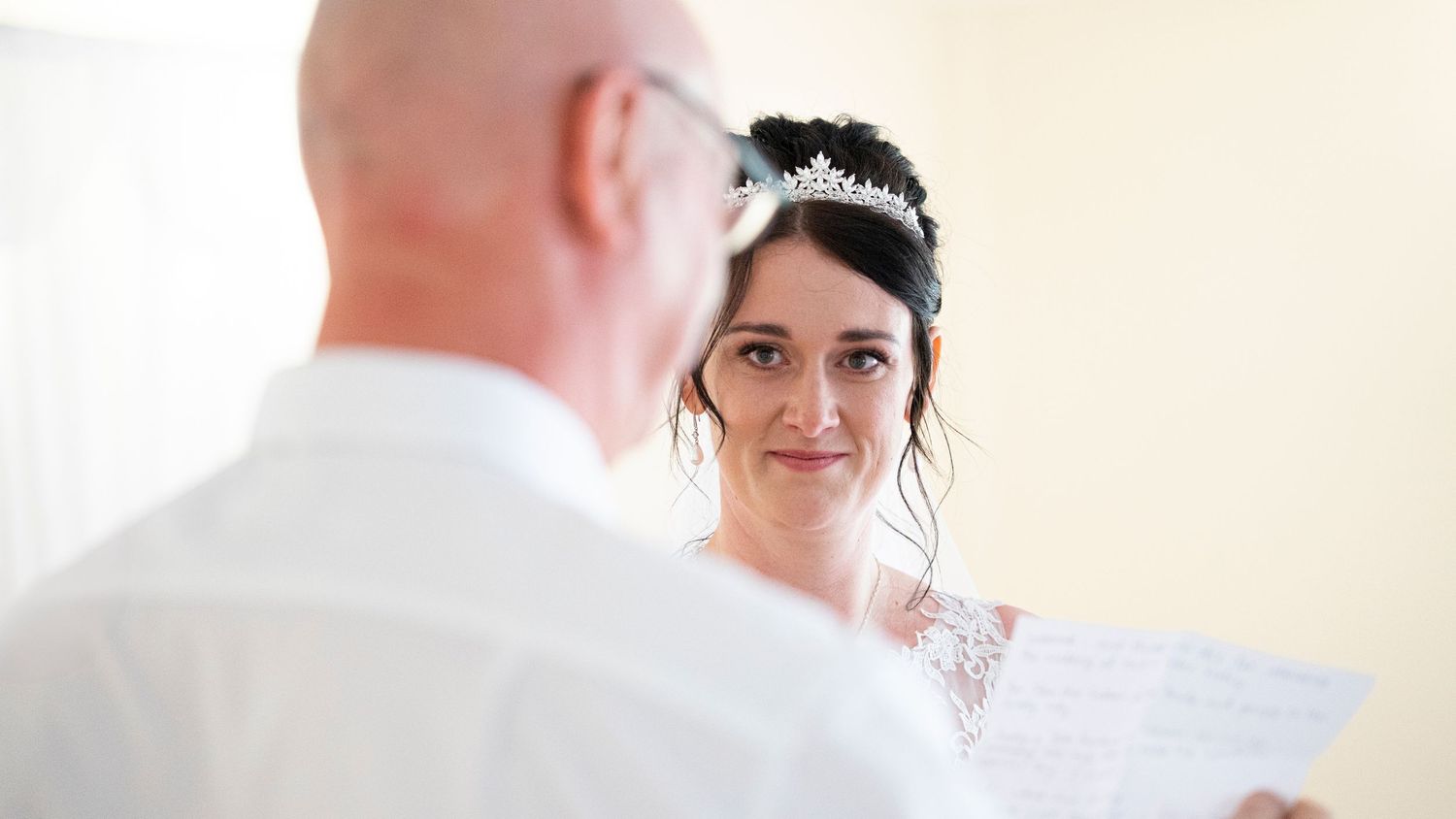 Indoor wedding ceremony sequence showing emotional moments and interactions.