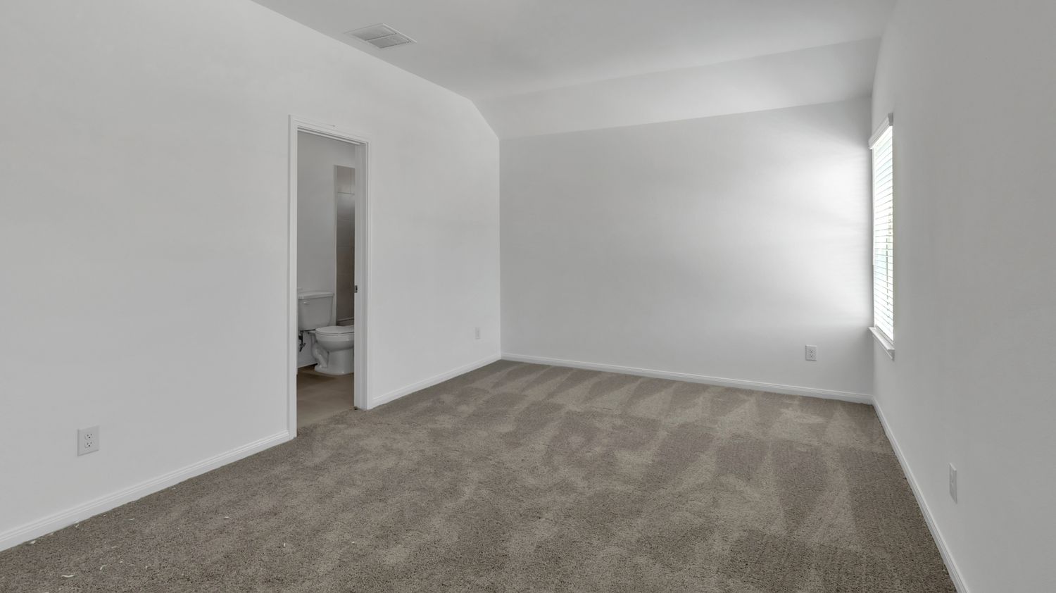 Five connected interior images of empty modern rooms with white walls and beige carpeting show a spacious home layout.