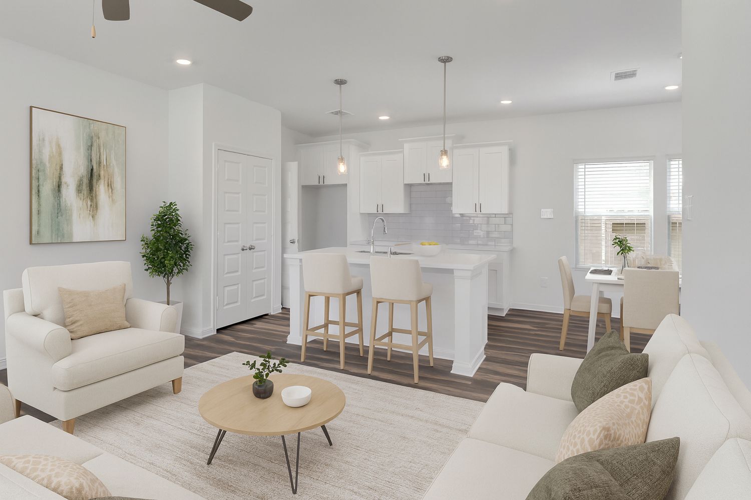 A well-staged living room showcases white sofas, beige accents, modern decor and natural lighting.