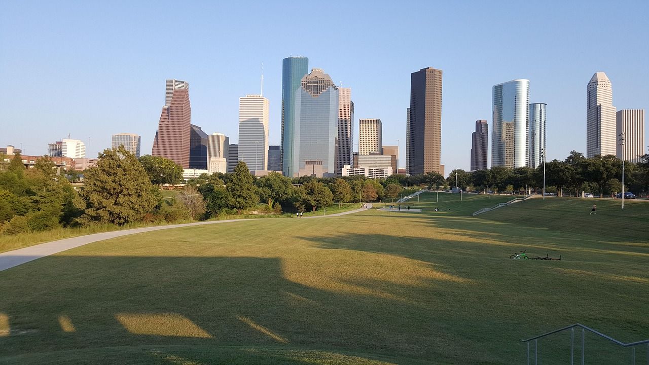 The Houston skyline at golden hour—a vibrant city we’re proud to serve with top-tier real estate photography.Houston skyline at sunset, repr