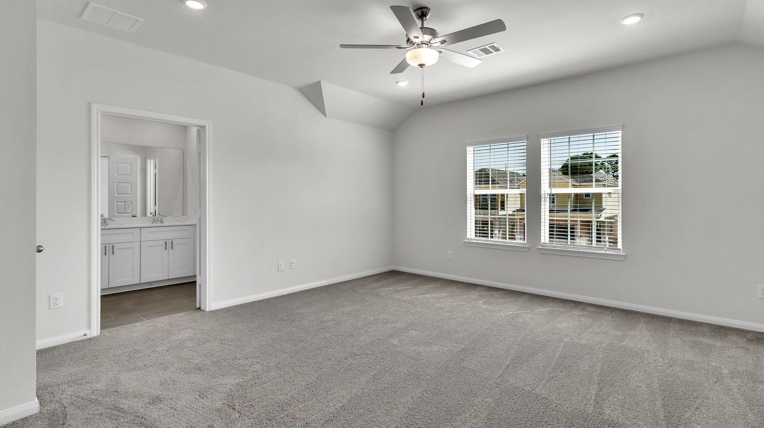 360-degree panoramic view of an empty modern interior with white walls and gray flooring.