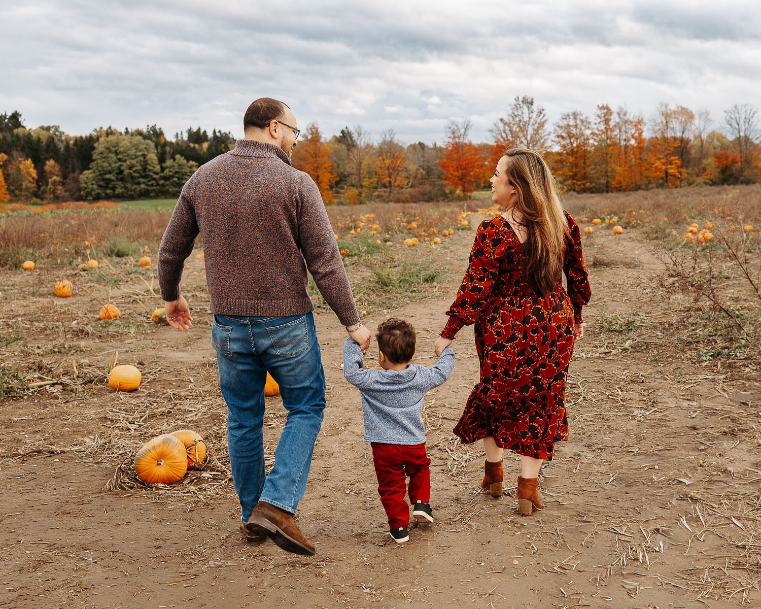 Family session pumpkin picking