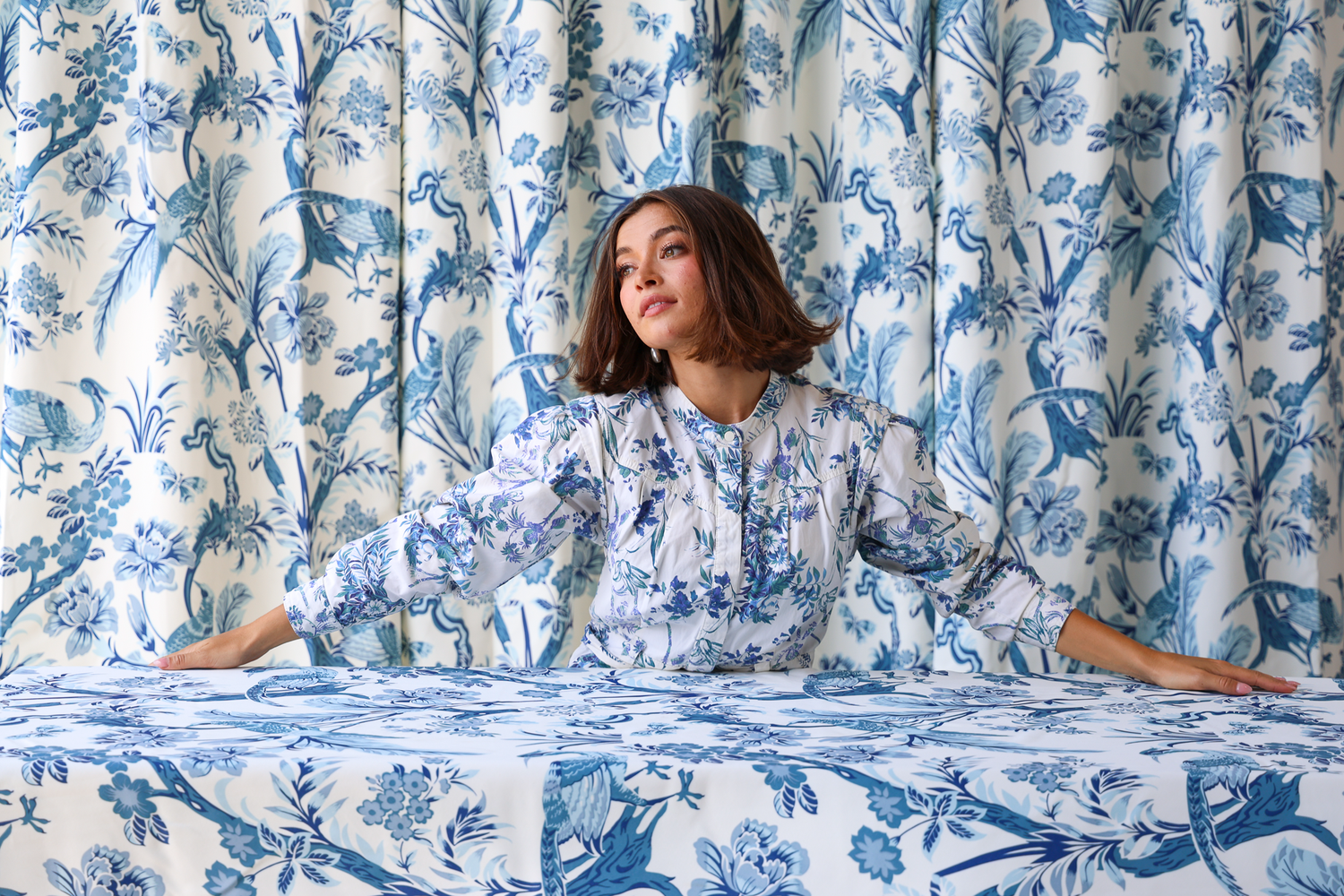 Creative portrait of a model posing in an editorial-inspired studio setting