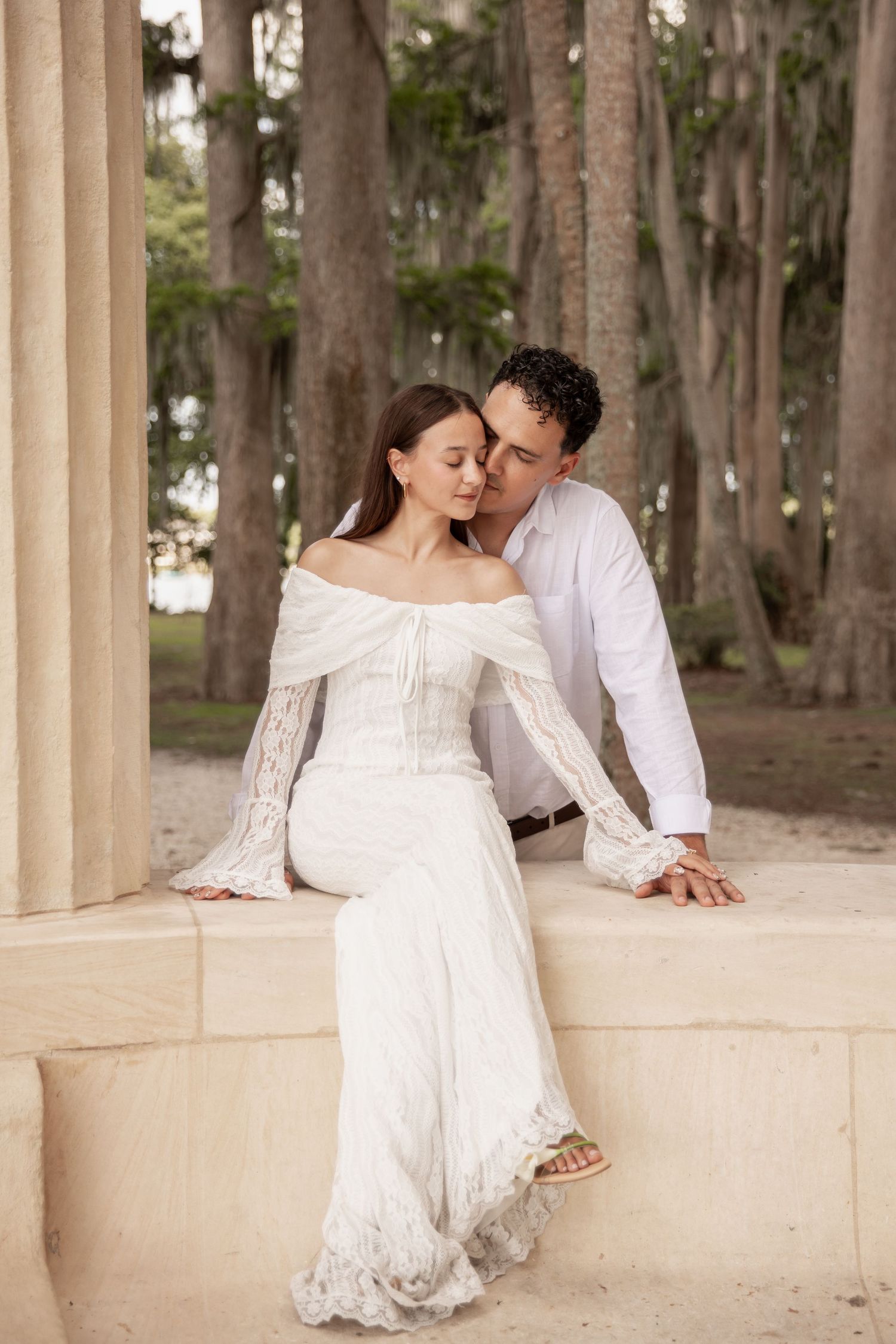 Joyful engagement session under Spanish moss at Kraft Azalea Garden.