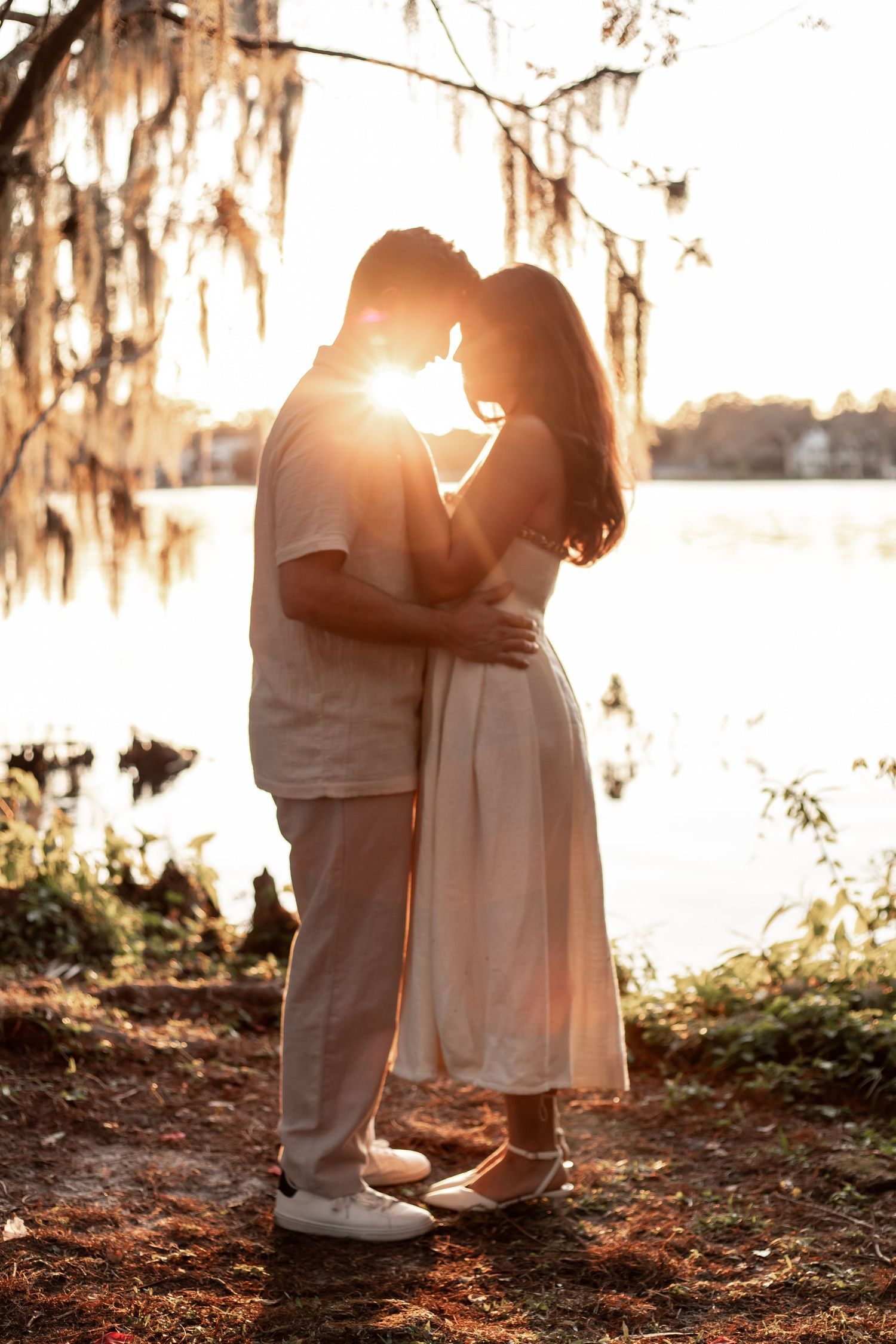 oyful engagement session under Spanish moss at Kraft Azalea Garden